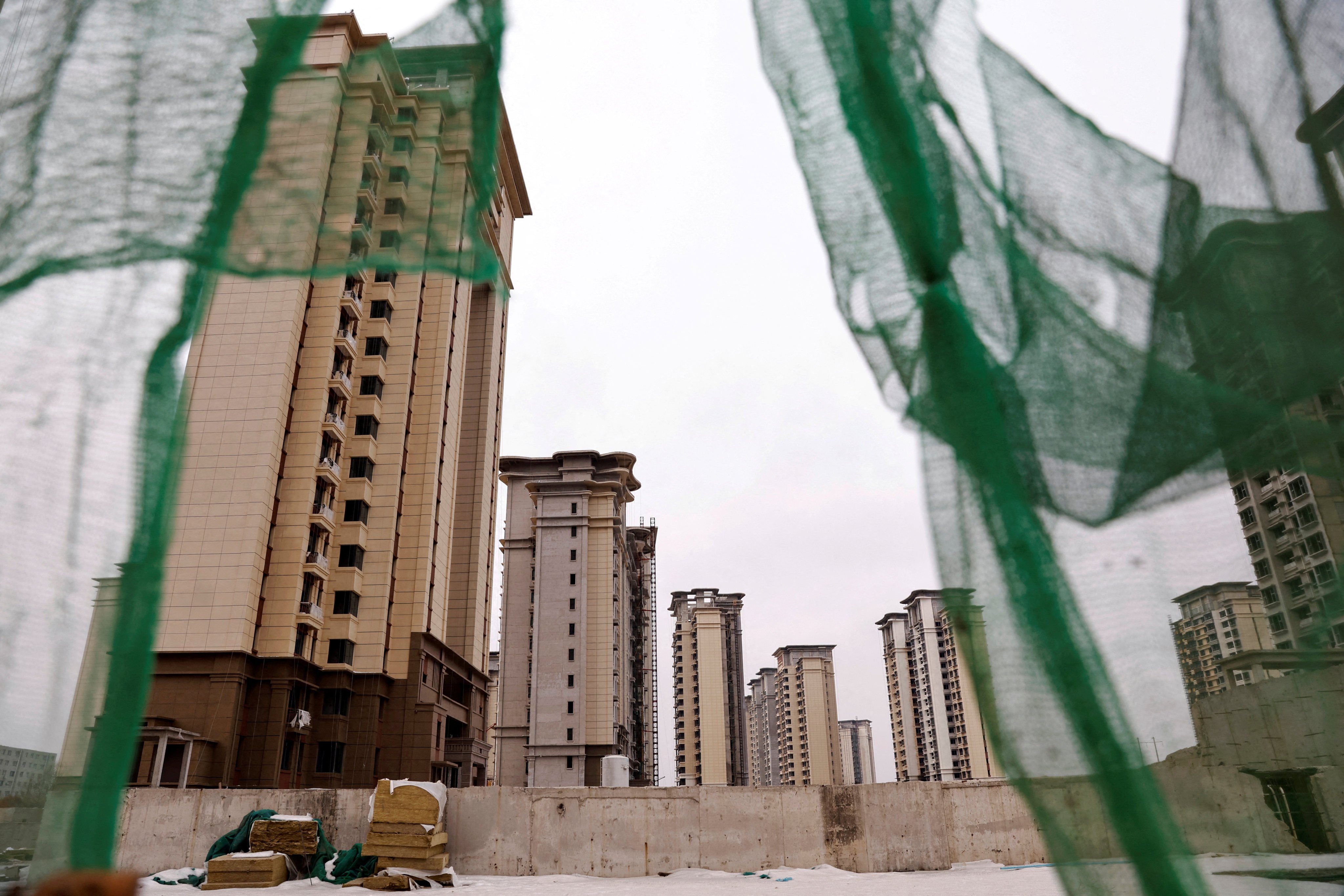 Unfinished residential buildings developed by China Evergrande Group in the outskirts of Shijiazhuang, Hebei province, on February 1. Persistent crises in the property sector and weak consumer demand are challenging China’s policymakers. Photo: Reuters