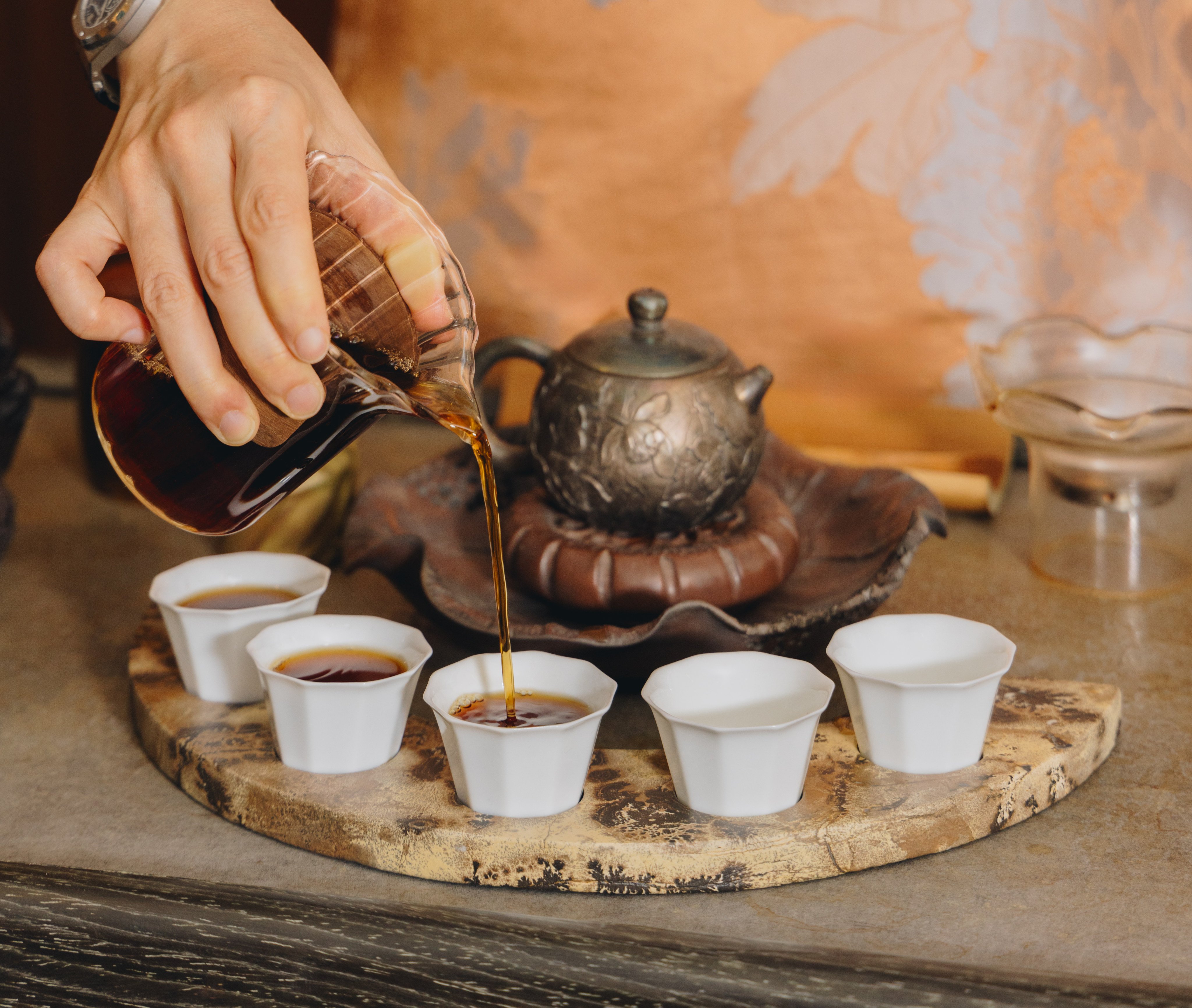 Cups of 1989 vintage camphor wood-scented raw Puer are prepared at Being & Tea. Photo: Jocelyn Tam