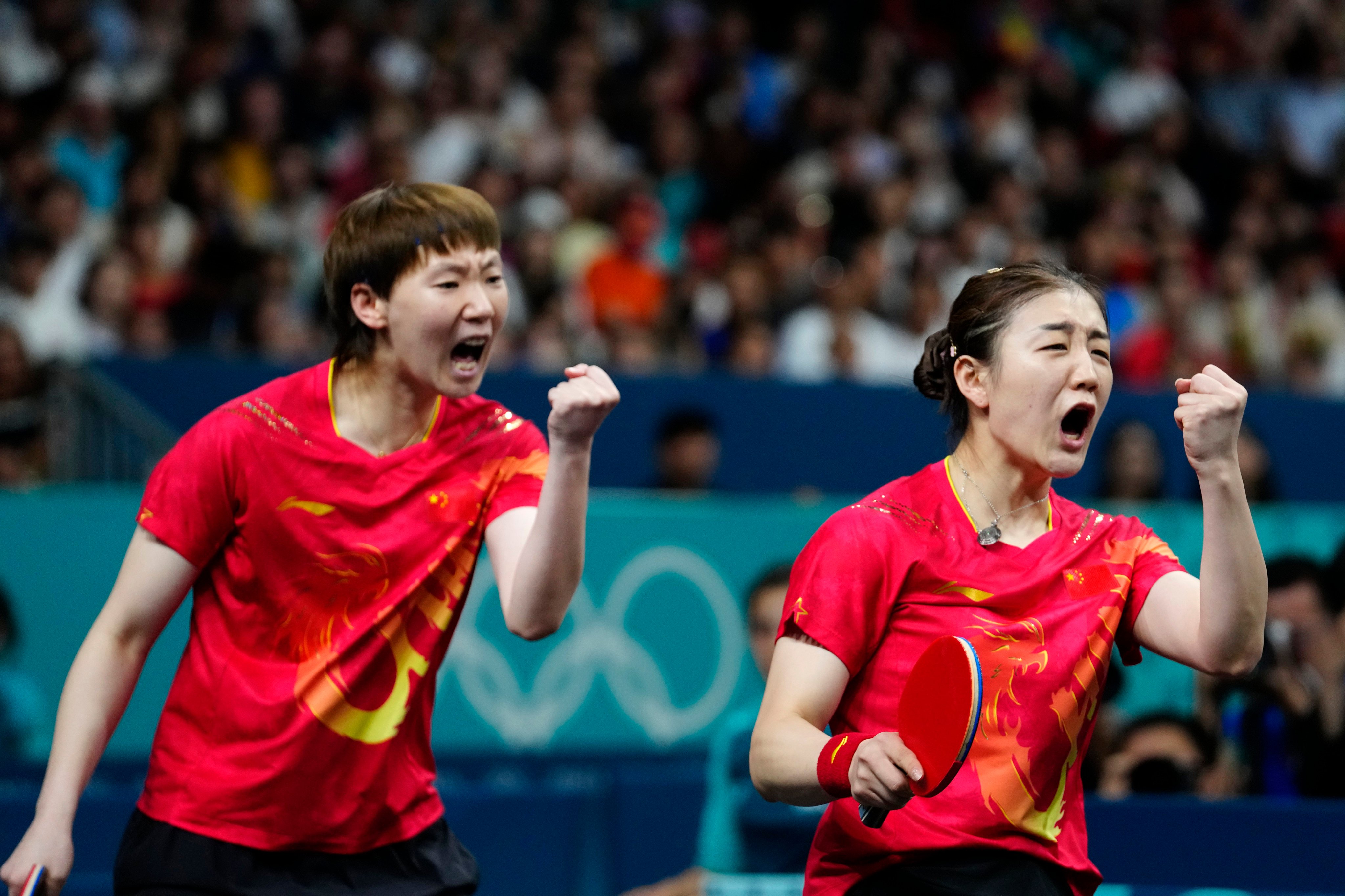 China’s Chen Meng (right) and Wang Manyu react after a winning set against Japan’s Miwa Harimtoto and Hina Hayata during the women’s gold medal team table tennis match at the Paris Olympics on August 10. Photo: AP 