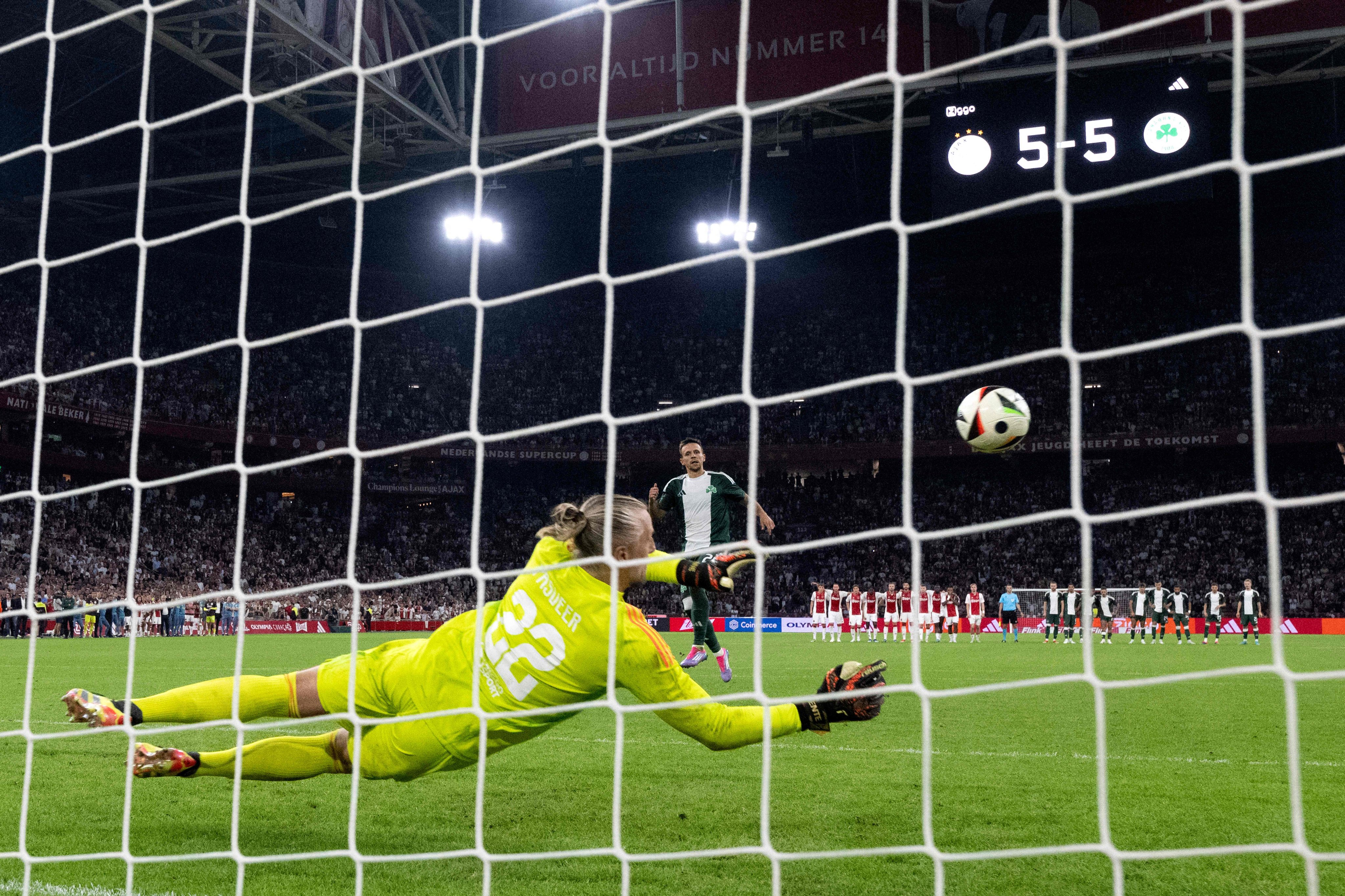 Ajax goalkeeper Remko Pasveer makes one of his five penalty saves during the shootout between Ajax and Panathinaikos in Amsterdam on Thursday. Photo: AFP