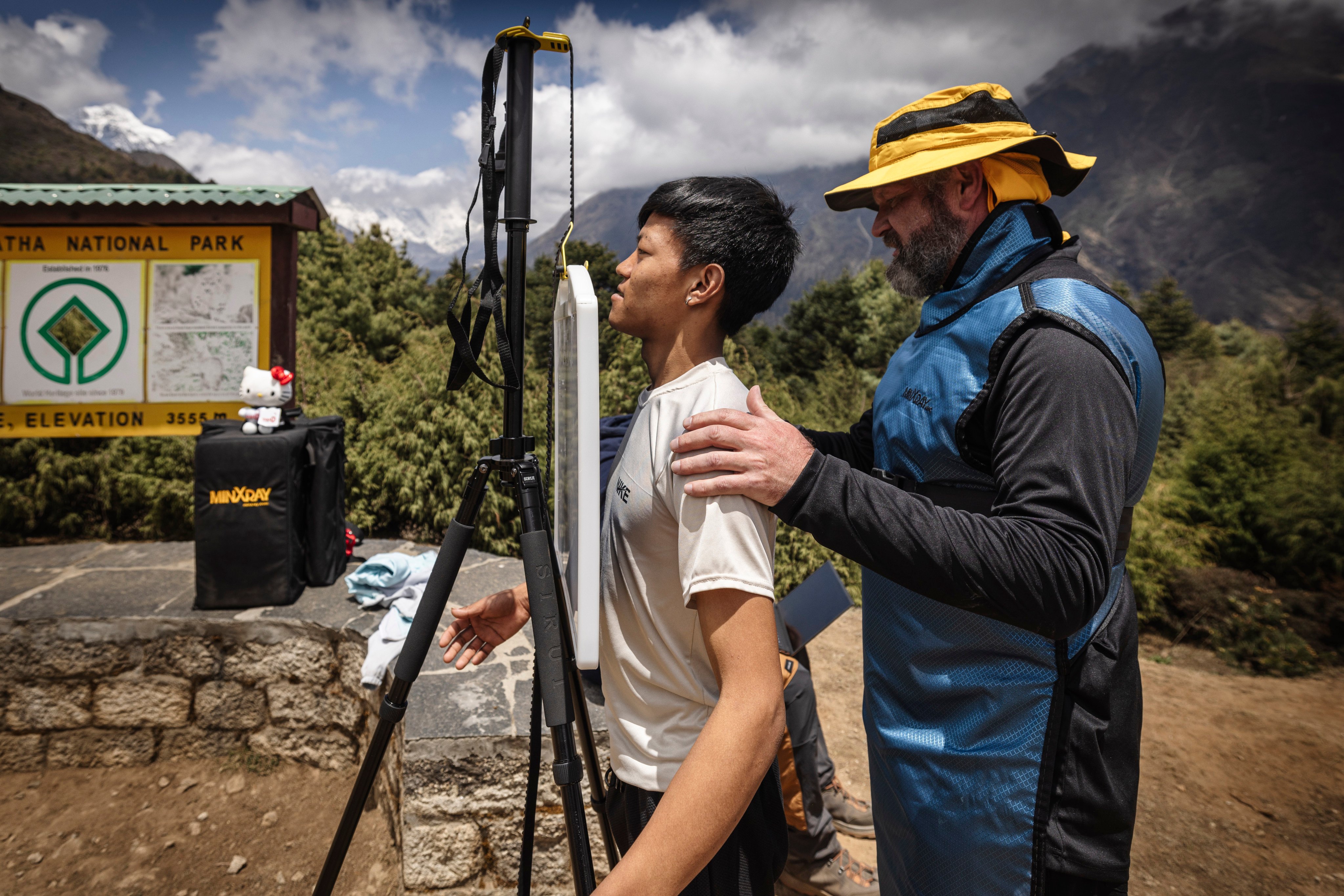 Radiologist Michael Cairnie prepares Bhim Raj, 21, for an outdoor X-ray at a height of 3,555 metres, showing the adaptability of advanced medical technology in the rugged Himalayan environment. Photo: Jonas Gratzer