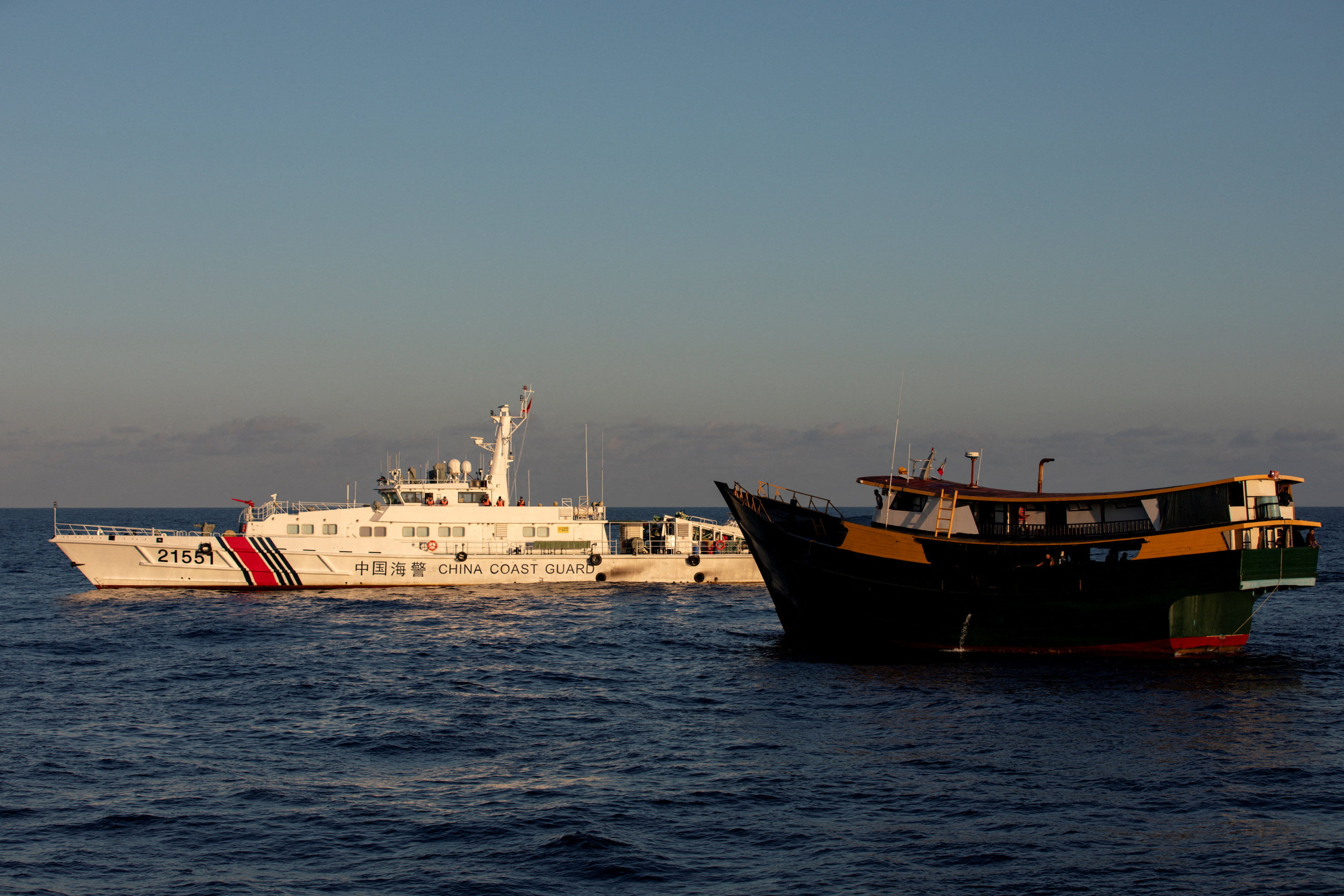 A Chinese coastguard vessel blocks a Philippine resupply vessel on its way to a resupply mission at the Second Thomas Shoal in the South China Sea in March. Photo: Reuters