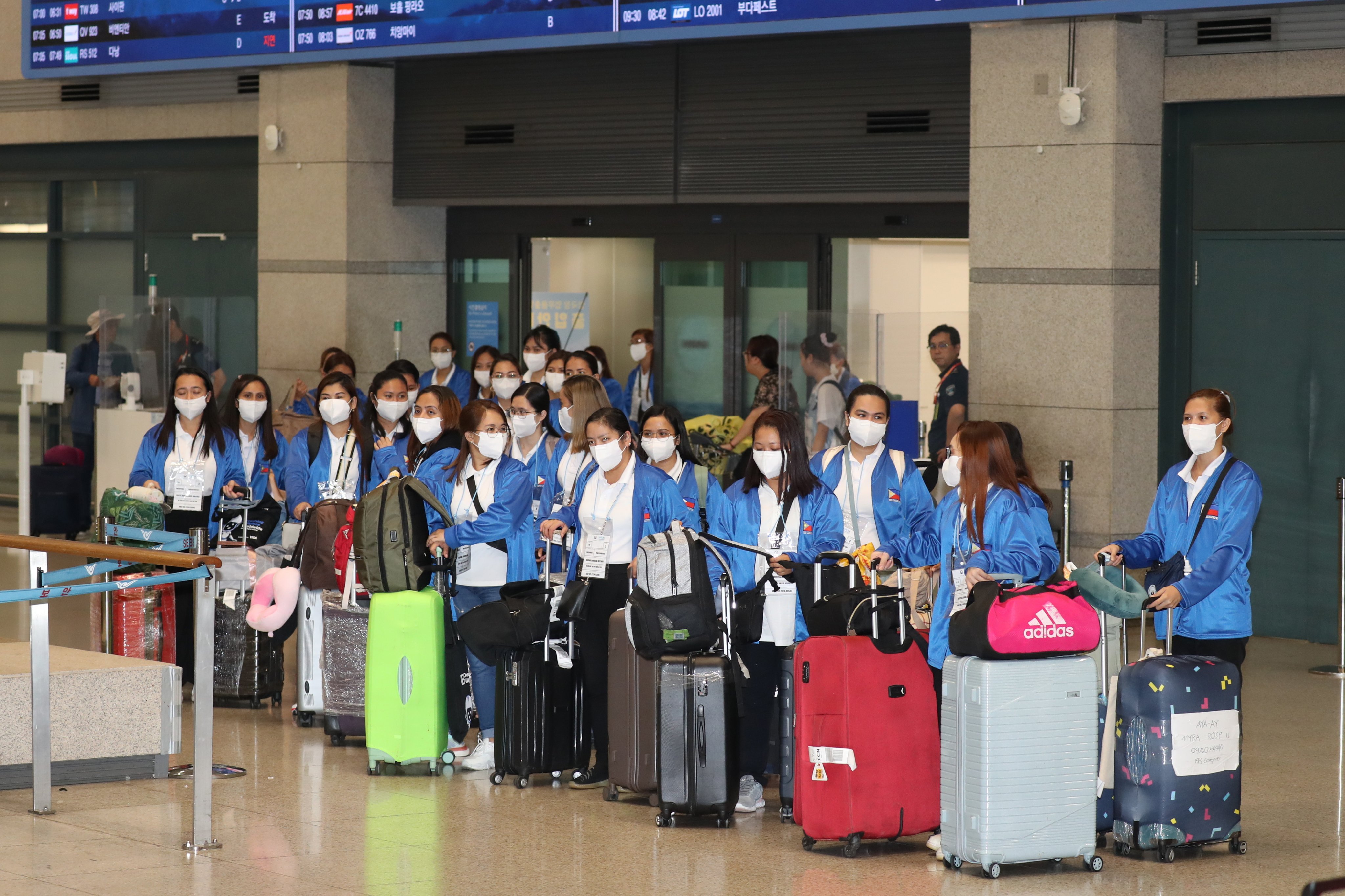 A group of 100 Filipino women, who will work as caregivers in South Korea under  a pilot programme, arrive at Incheon International Airport earlier this month. Photo: EPA-EFE