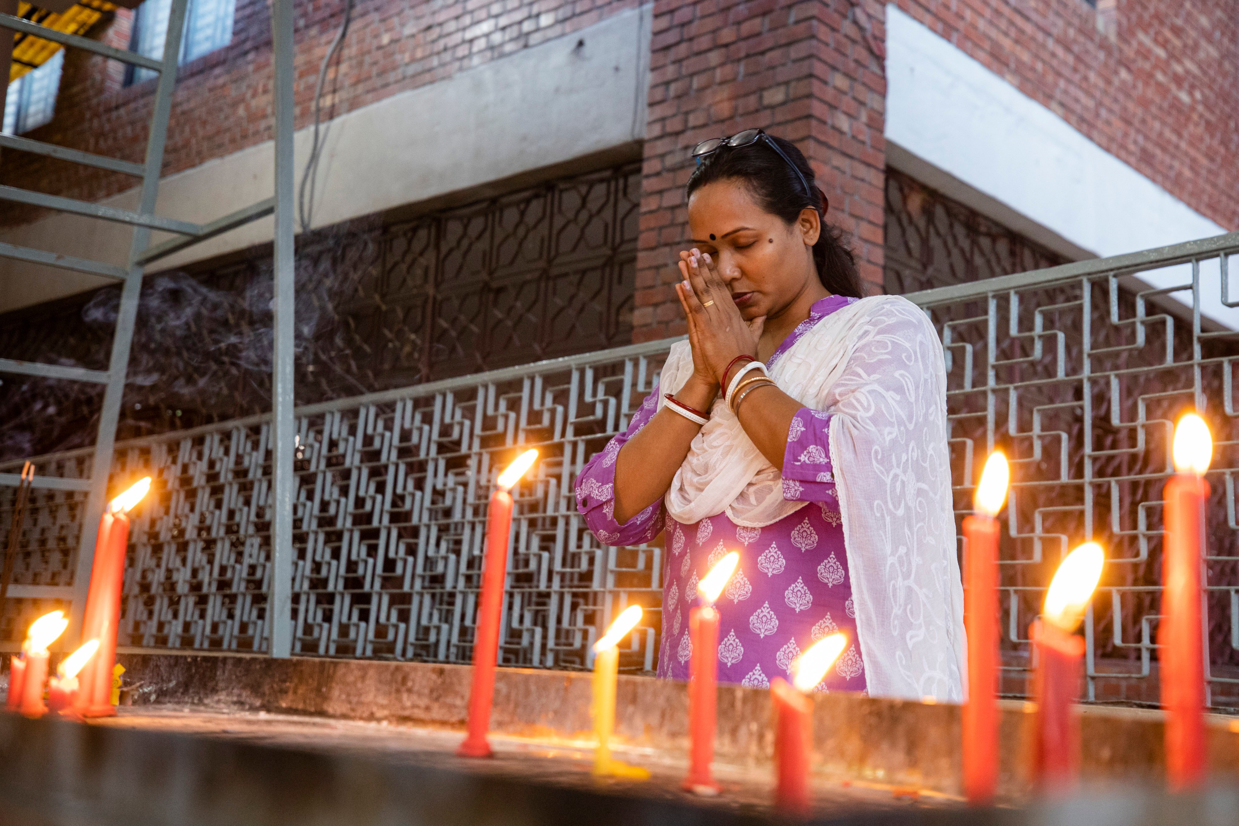 A Hindu woman prays at the Dhakeshwari National Temple in Dhaka, Bangladesh. Hindus constitute about 8 per cent of Bangladesh’s population. Photo: AP