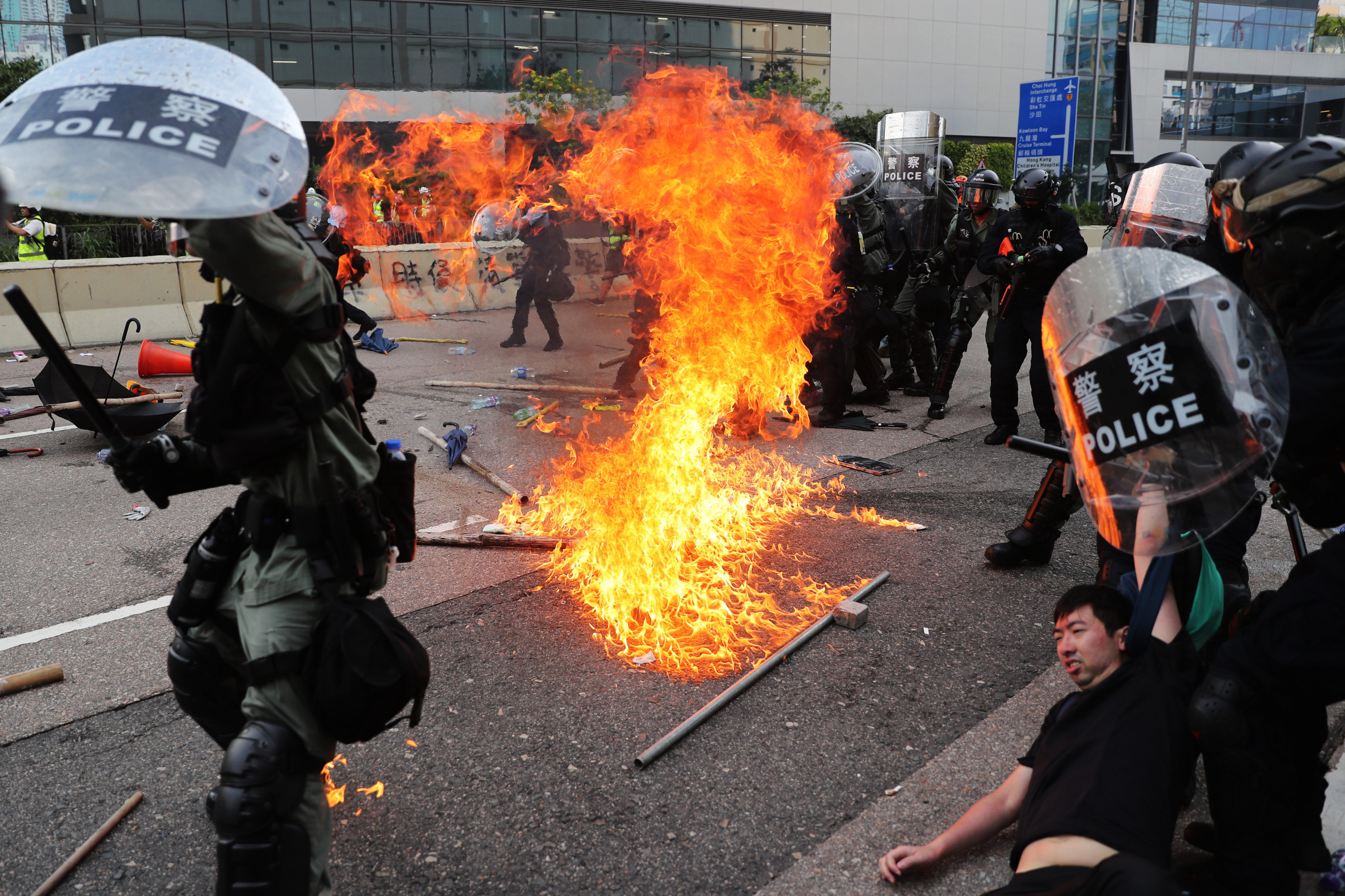 A petrol bomb lands near riot police in Ngau Tau Kok during protests in August 2019. Photo: Sam Tsang