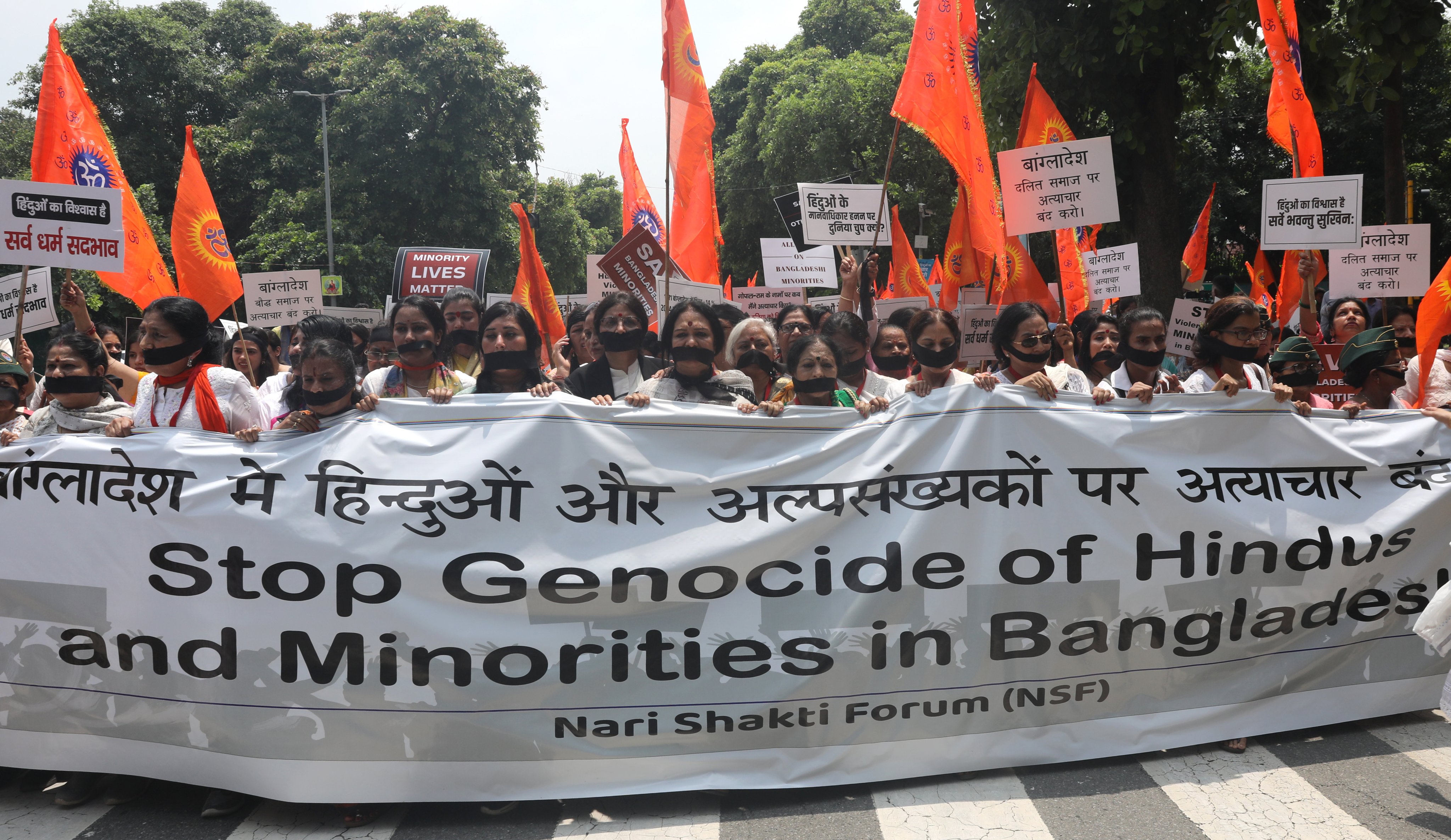 Members of the Nari Shakti Forum and their supporters take part in a protest march against alleged atrocities on Bangladeshi Hindus and other minorities, in New Delhi on Friday. Photo: EPA-EFE