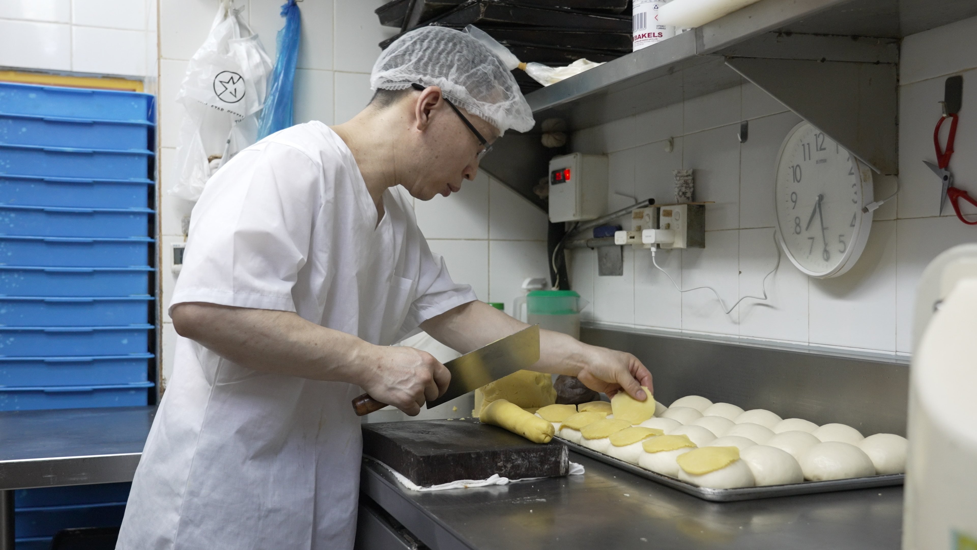 Chef Lam Kin-ming making pineapple buns at Lucky Star bakery in Hong Kong. Photo: Llewellyn Cheung