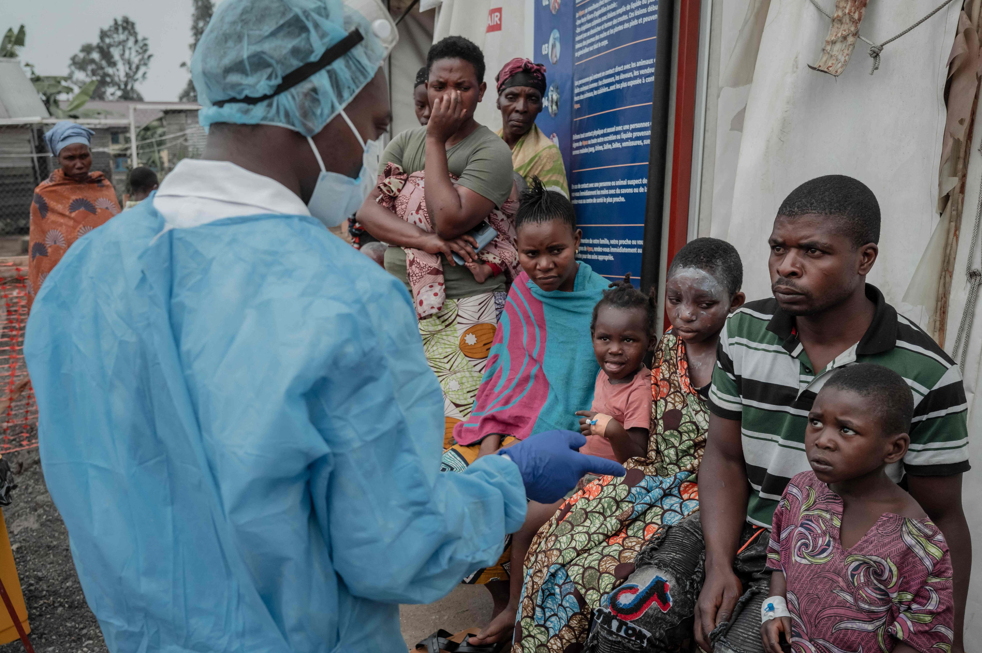 Patients listen to a doctor outside the Mpox treatment centre at Nyiragongo General Referral Hospital on August 17. Photo: AFP