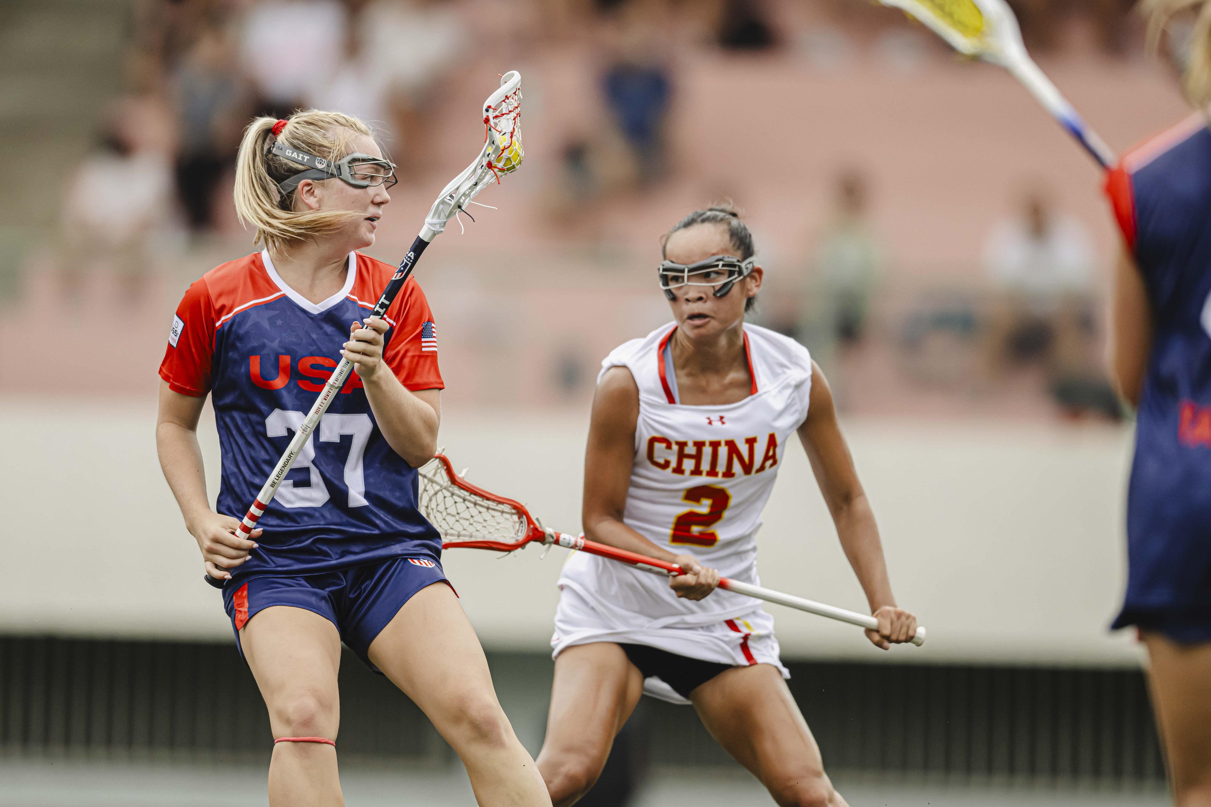 China’s Sara Junlan Curley (right) battles for the ball with Ally Reilly. Photo: Hong Kong, China Lacrosse Association