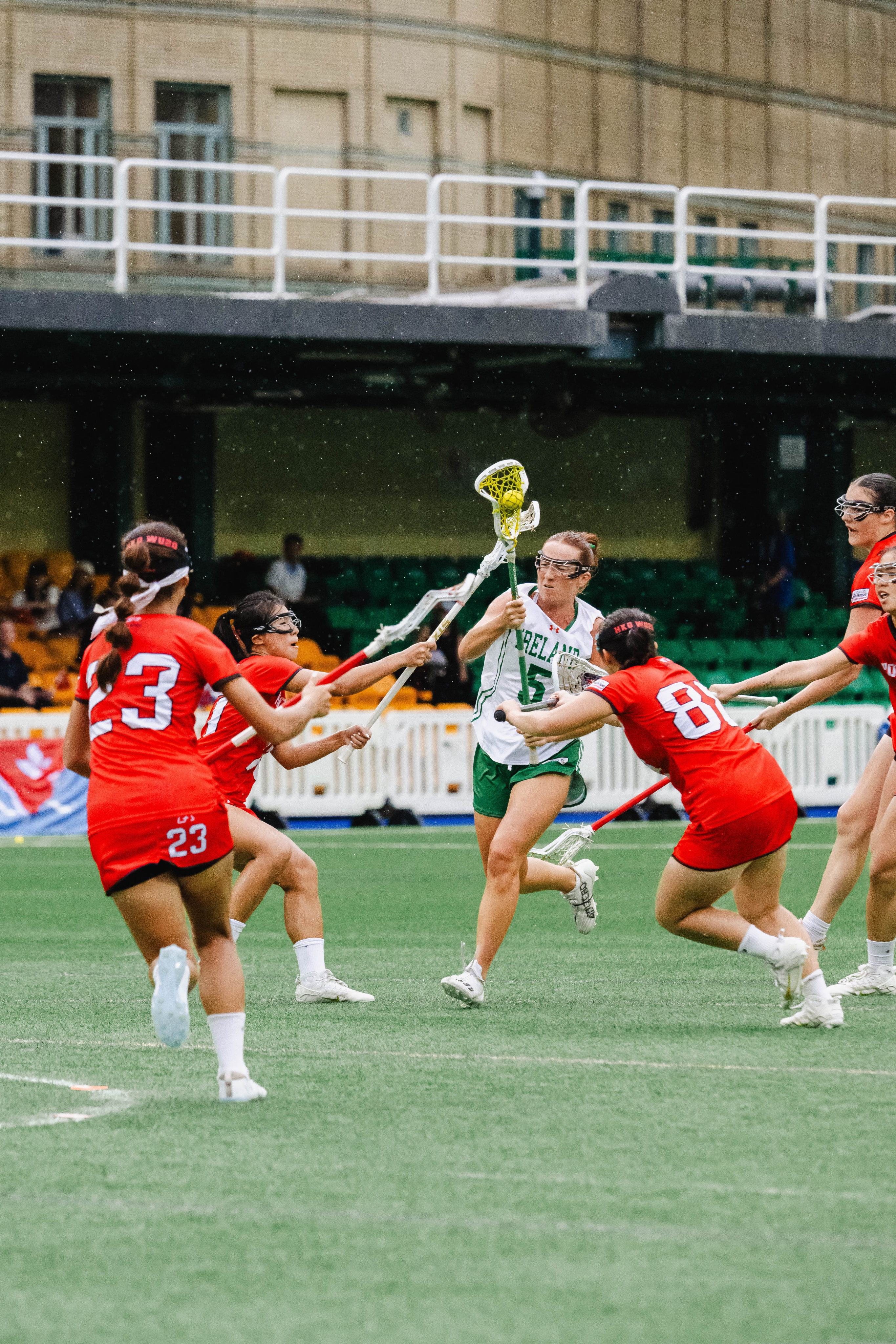 Ireland’s Bridget Valentine, who scored four goals, tries to breach Hong Kong’s defence. Photo: HKLAX