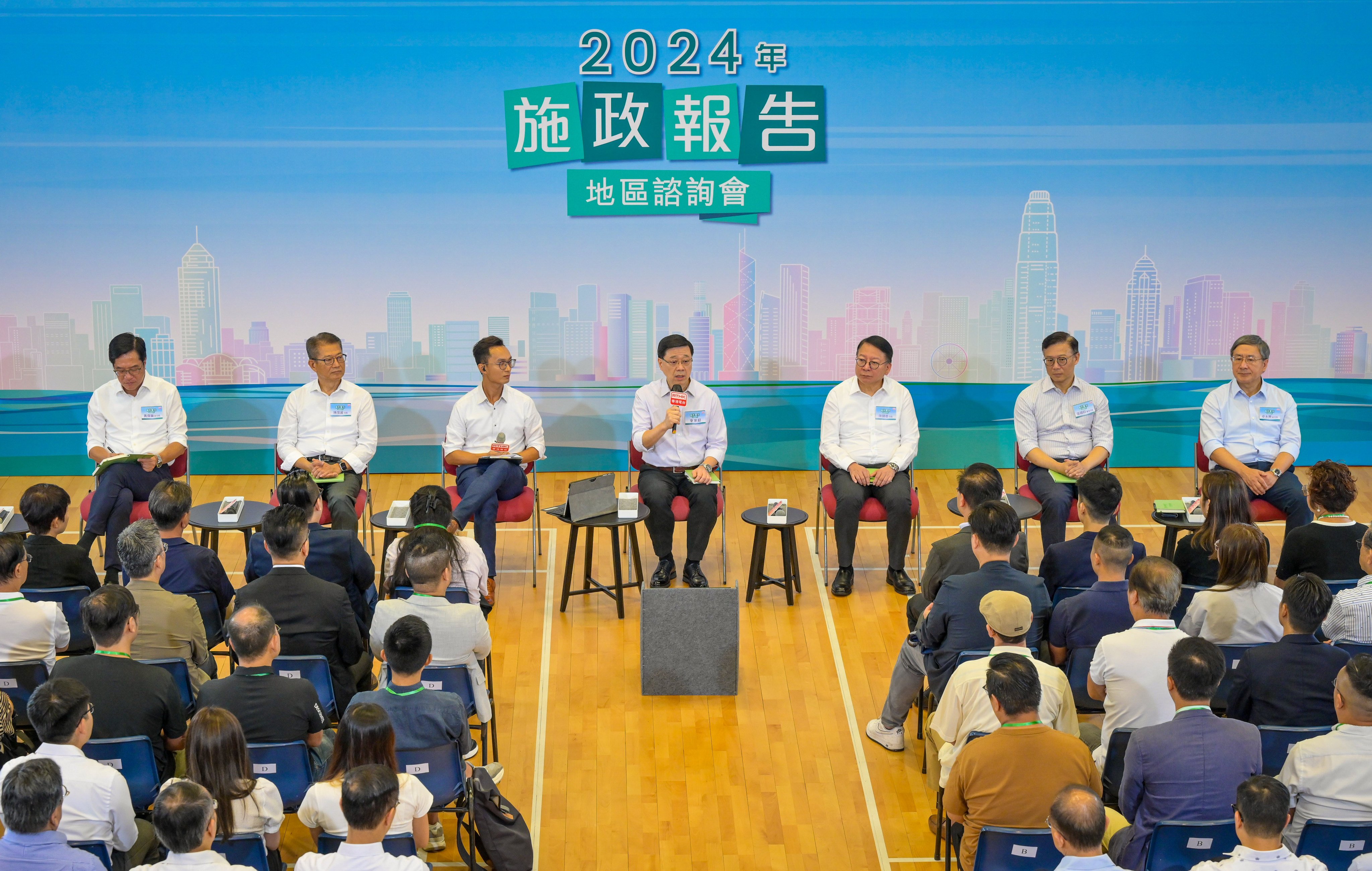 City leader John Lee (centre) says government policies will take the public’s views into account. Photo: ISD