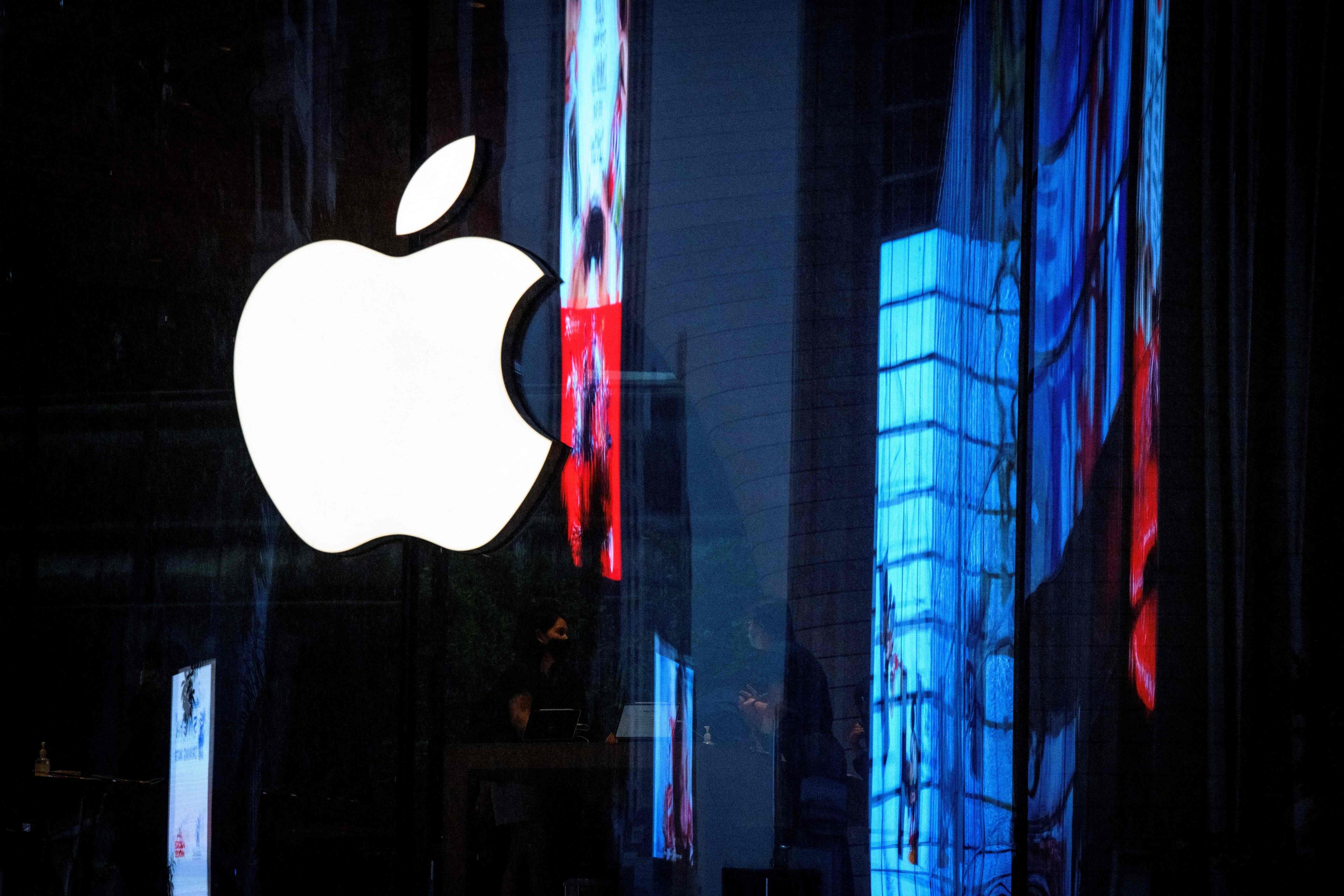 The Apple logo is seen on the window of a newly opened store in Bangkok, Thailand, in September 2020. Photo: AFP