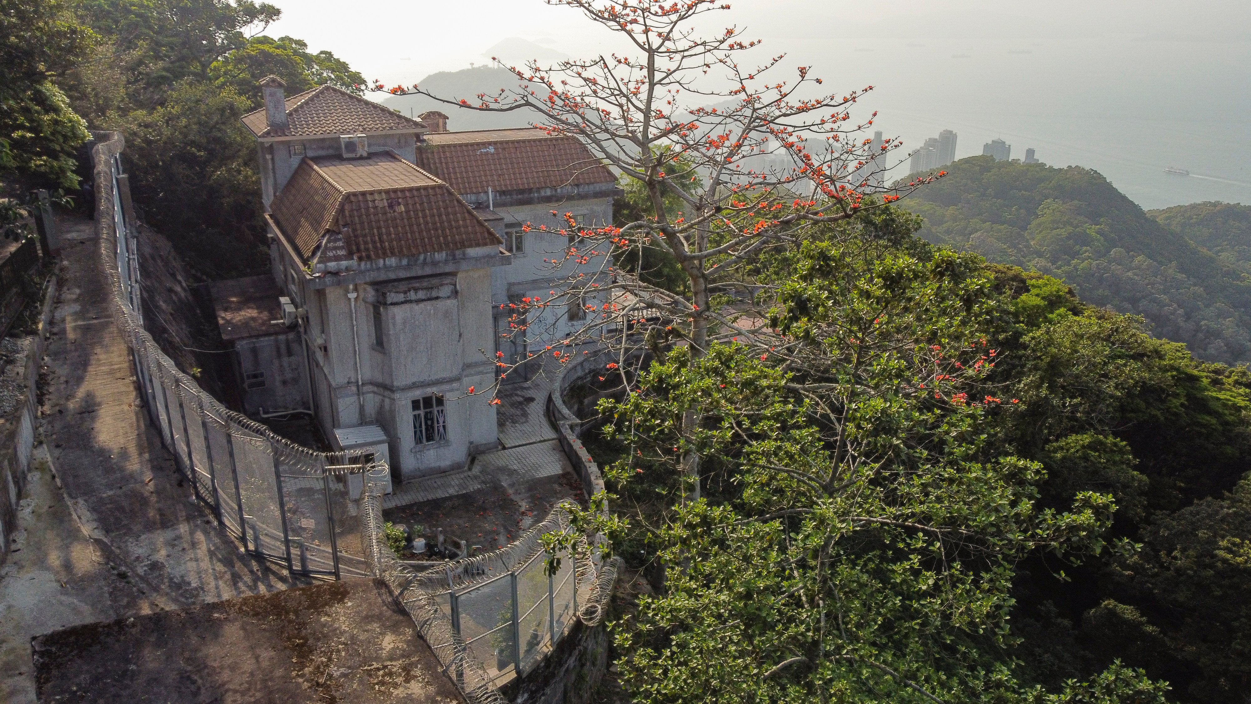 A view of the supposedly haunted Dragon Lodge on The Peak in Hong Kong. The stigma attached to living in a place where an unnatural death occurred makes it hard to rent or sell them, although deep discounts can work. Photo: Martin Chan