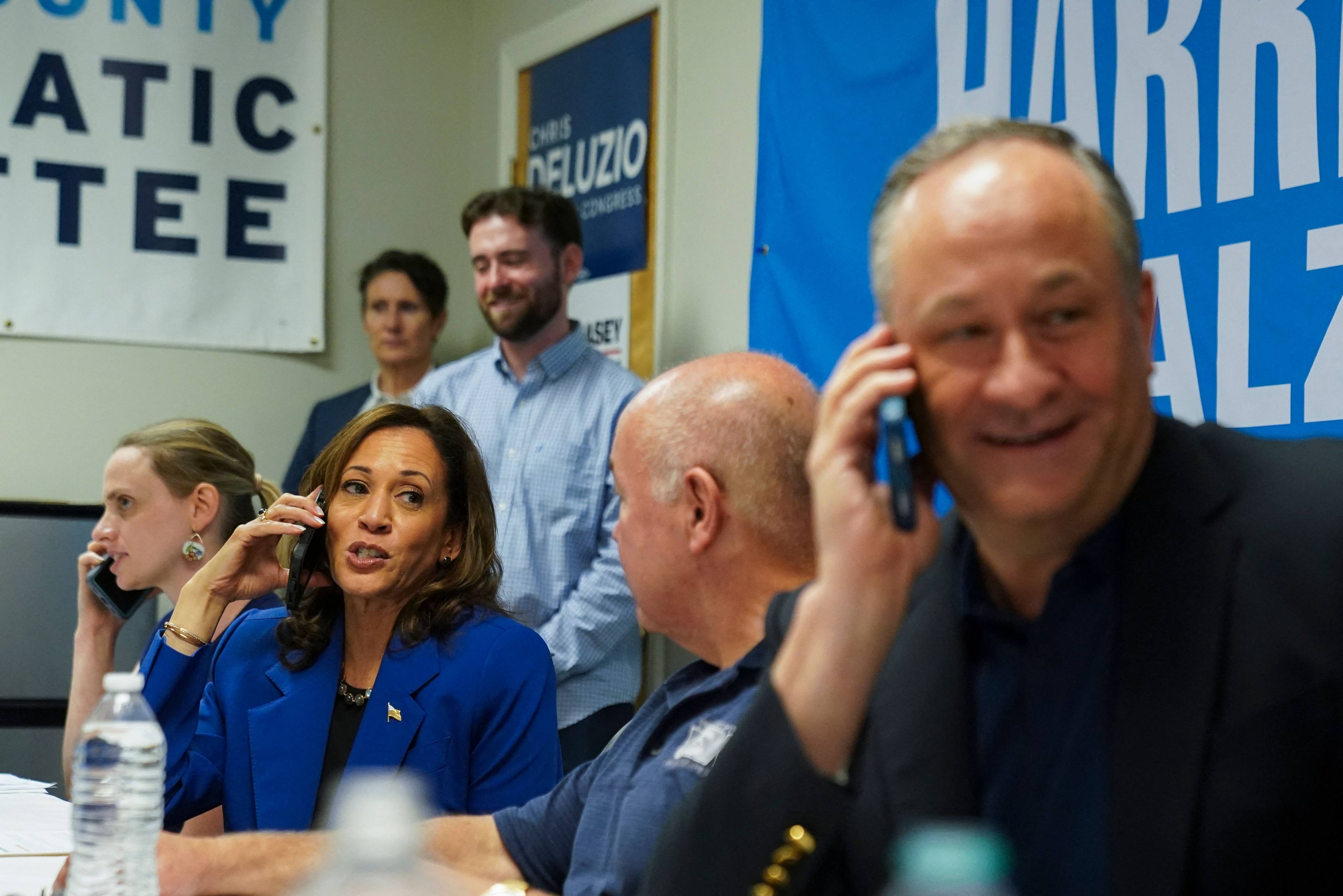 US vice-president and Democratic presidential candidate Kamala Harris, and second gentleman Doug Emhoff (far right), call prospective voters from a campaign field office in Rochester, Pennsylvania, on August 18. Photo: AFP