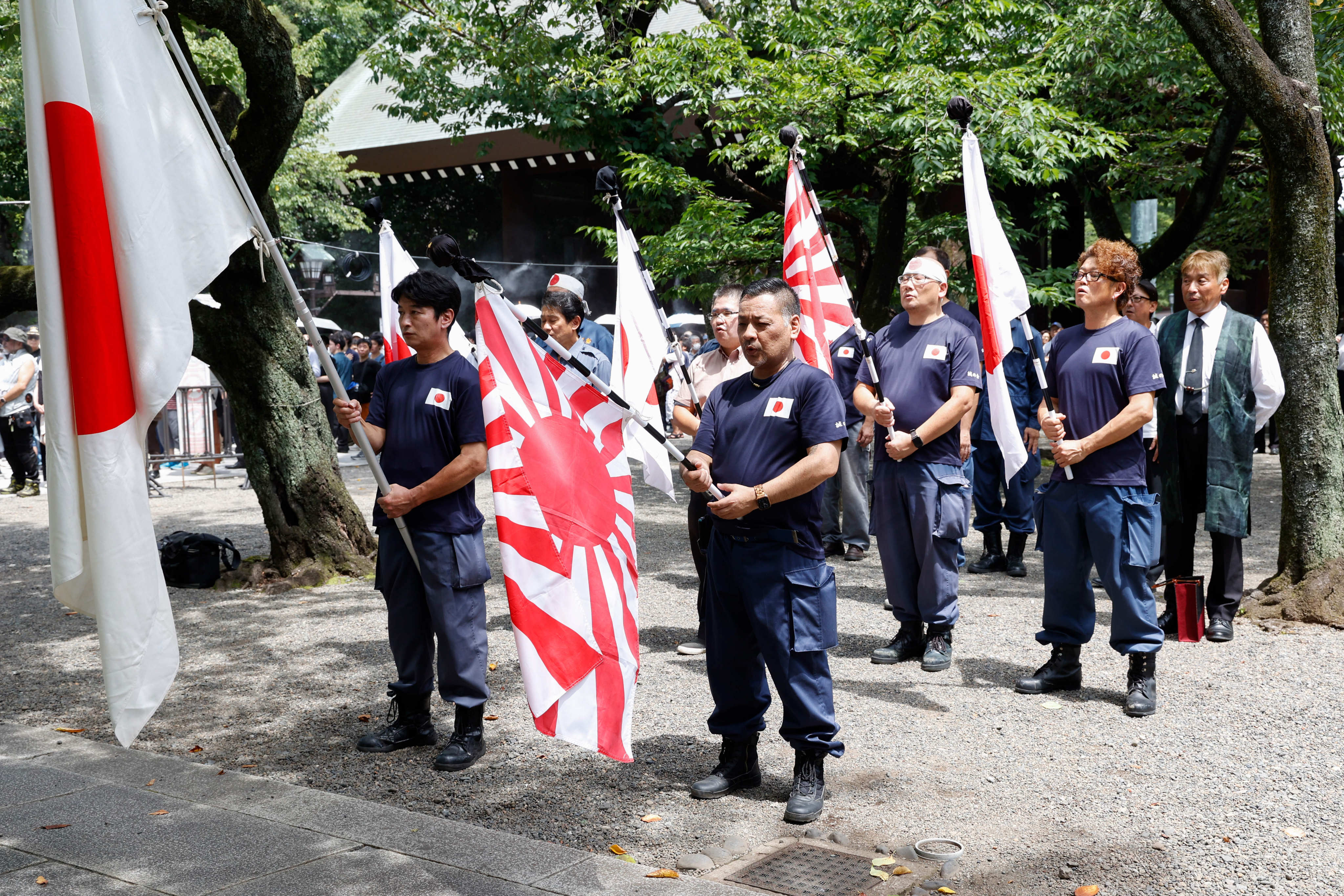 Japanese nationalists holding war flags of the Imperial Japanese Army visit Tokyo’s Yasukuni Shrine earlier this month. Photo: dpa