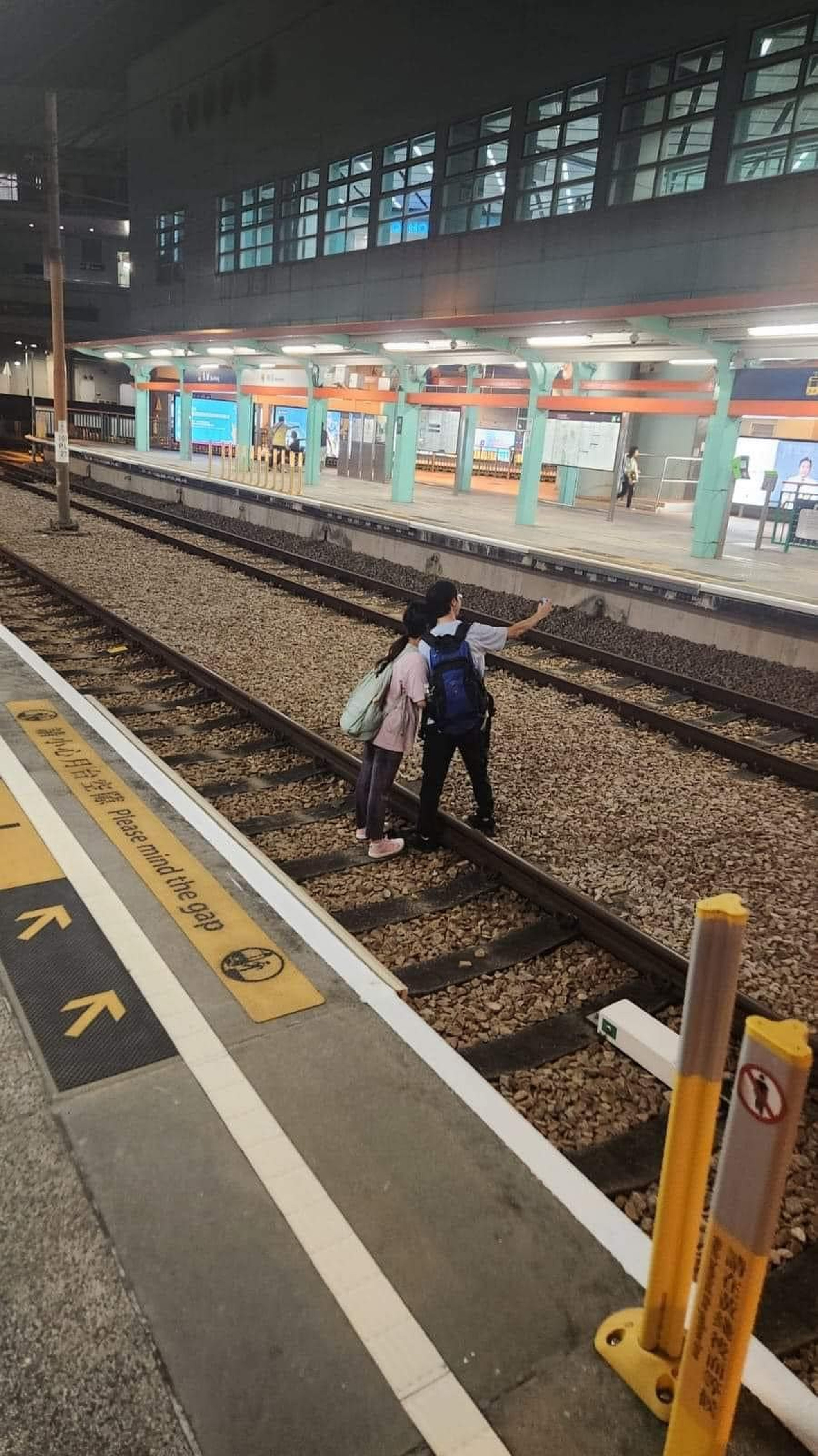 A couple taking selfies on tracks in Tuen Mun has sparked a wave of criticism. Photo: Handout