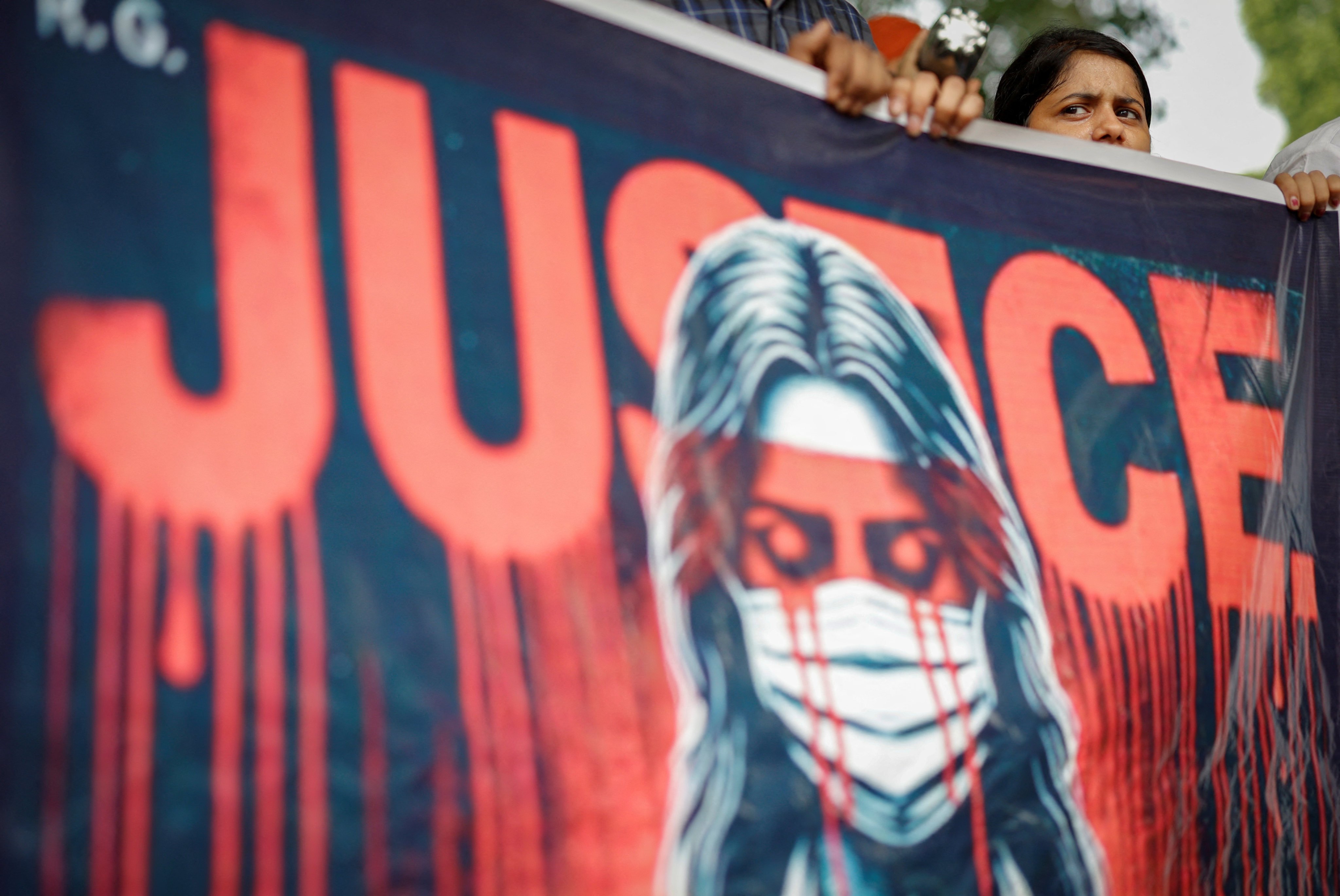 A doctor holds a banner during a protest in New Delhi on Monday following the rape and murder at a hospital in Kolkata earlier this month. Photo: Reuters