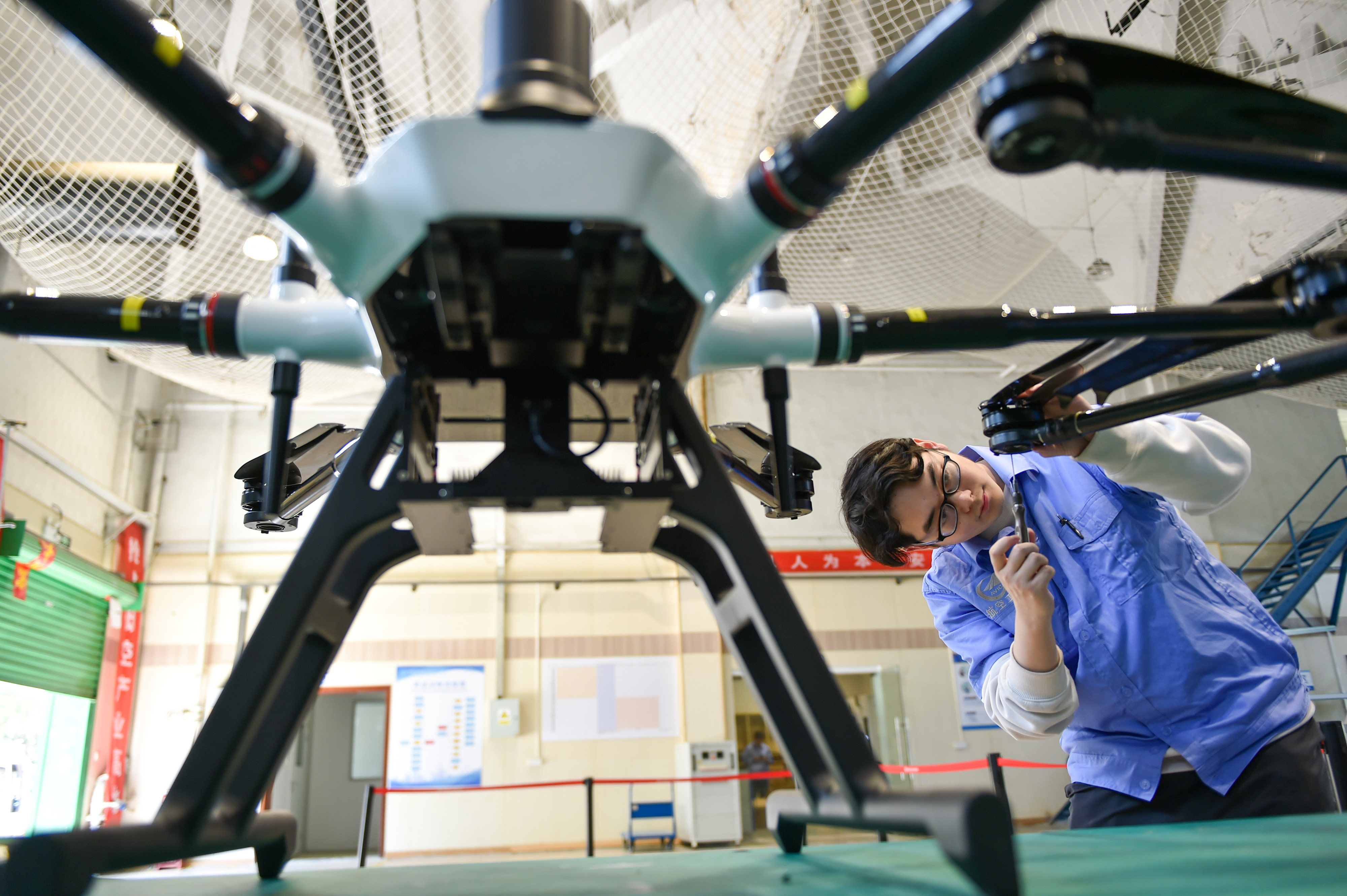 Workers assemble civilian multi-rotor drones at a production workshop of a drone factory in Nanjing, Jiangsu province. Photo: Future Publishing via Getty Images