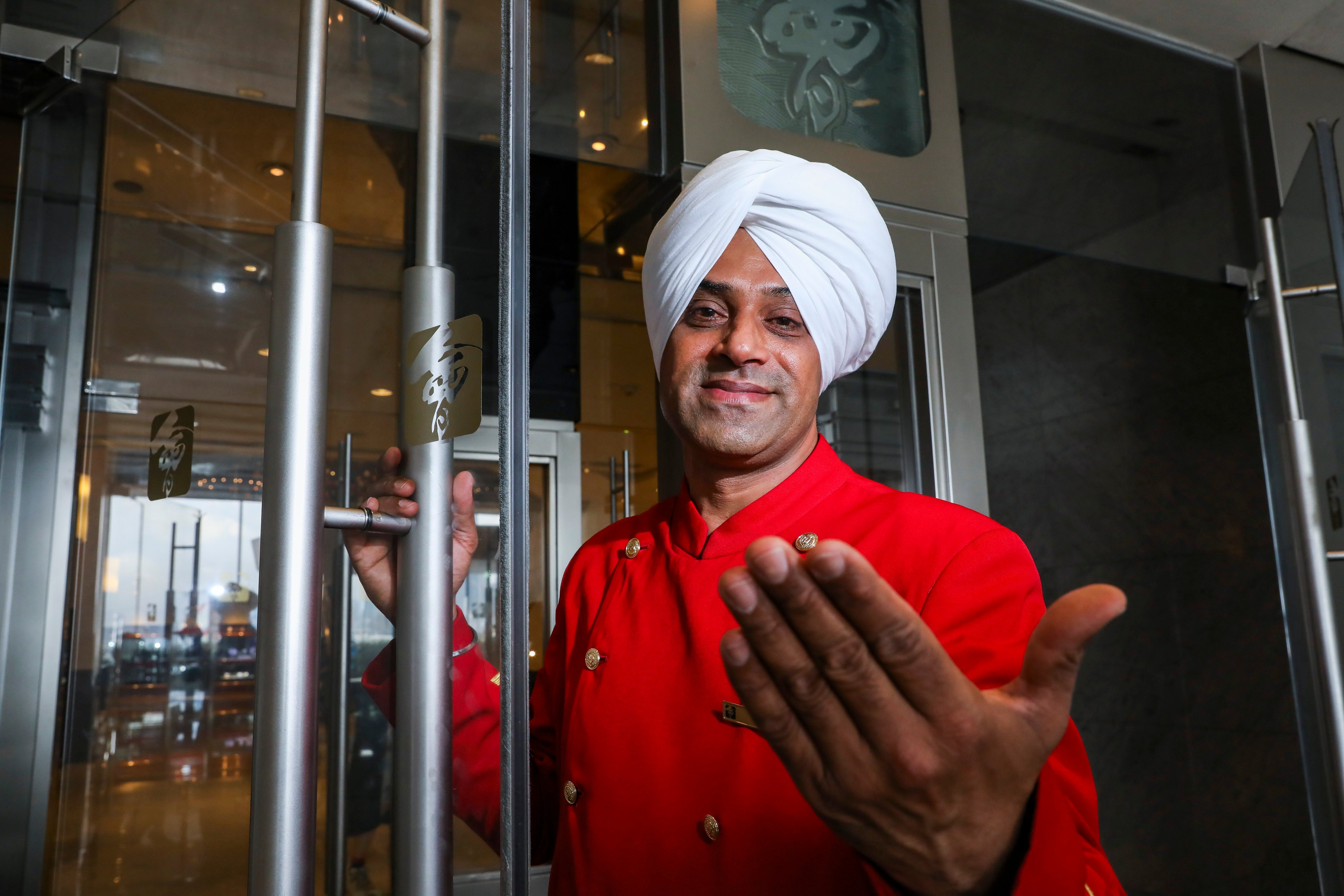 Kam Singh, a doorman at the Excelsior Hotel in Causeway Bay, in February 2019. Photo: SCMP