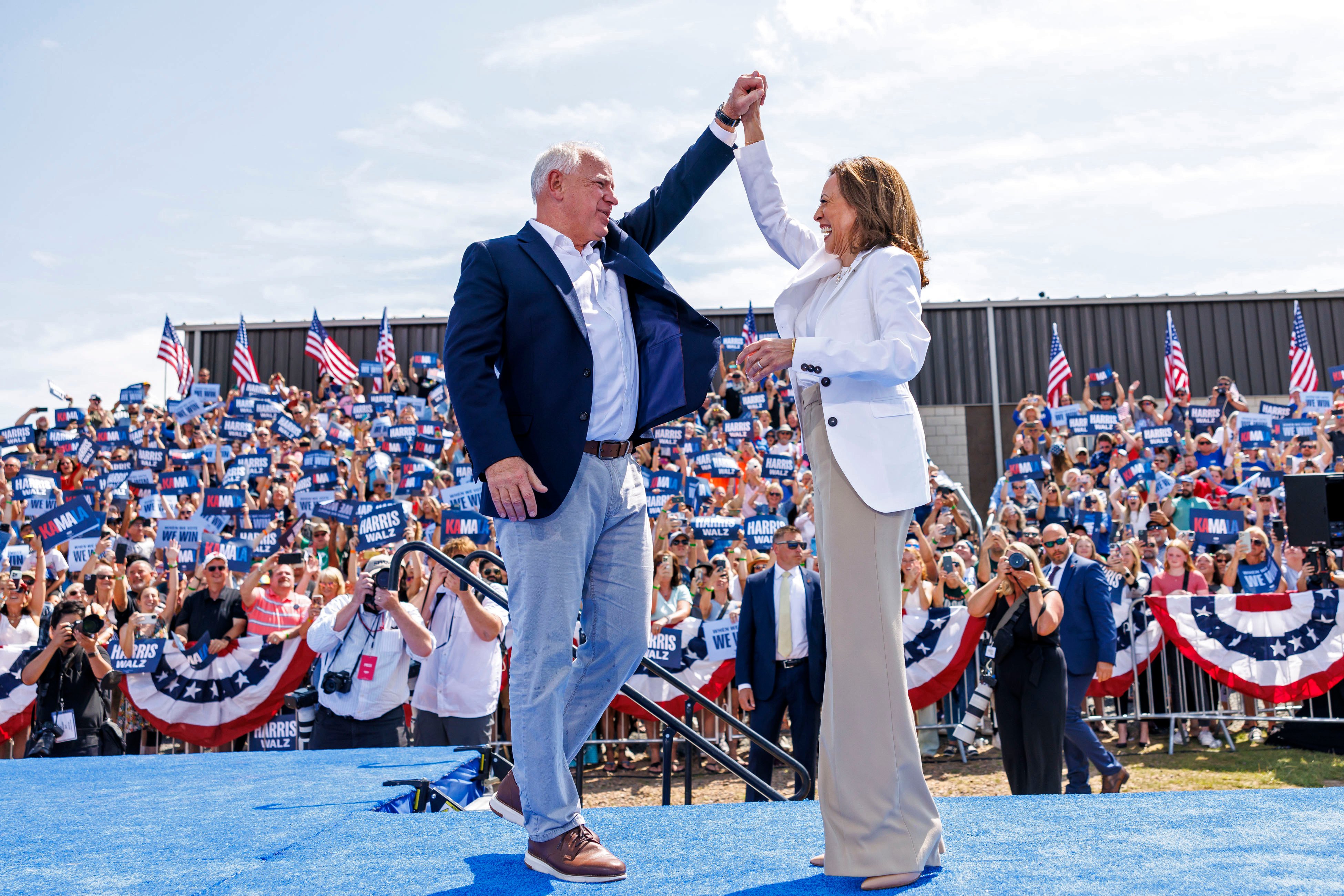 Democratic presidential nominee Vice-President Kamala Harris is welcomed by running mate Tim Walz at a campaign rally in Eau Claire, Wisconsin on August 7. Photo: Minnesota Public Radio via AP