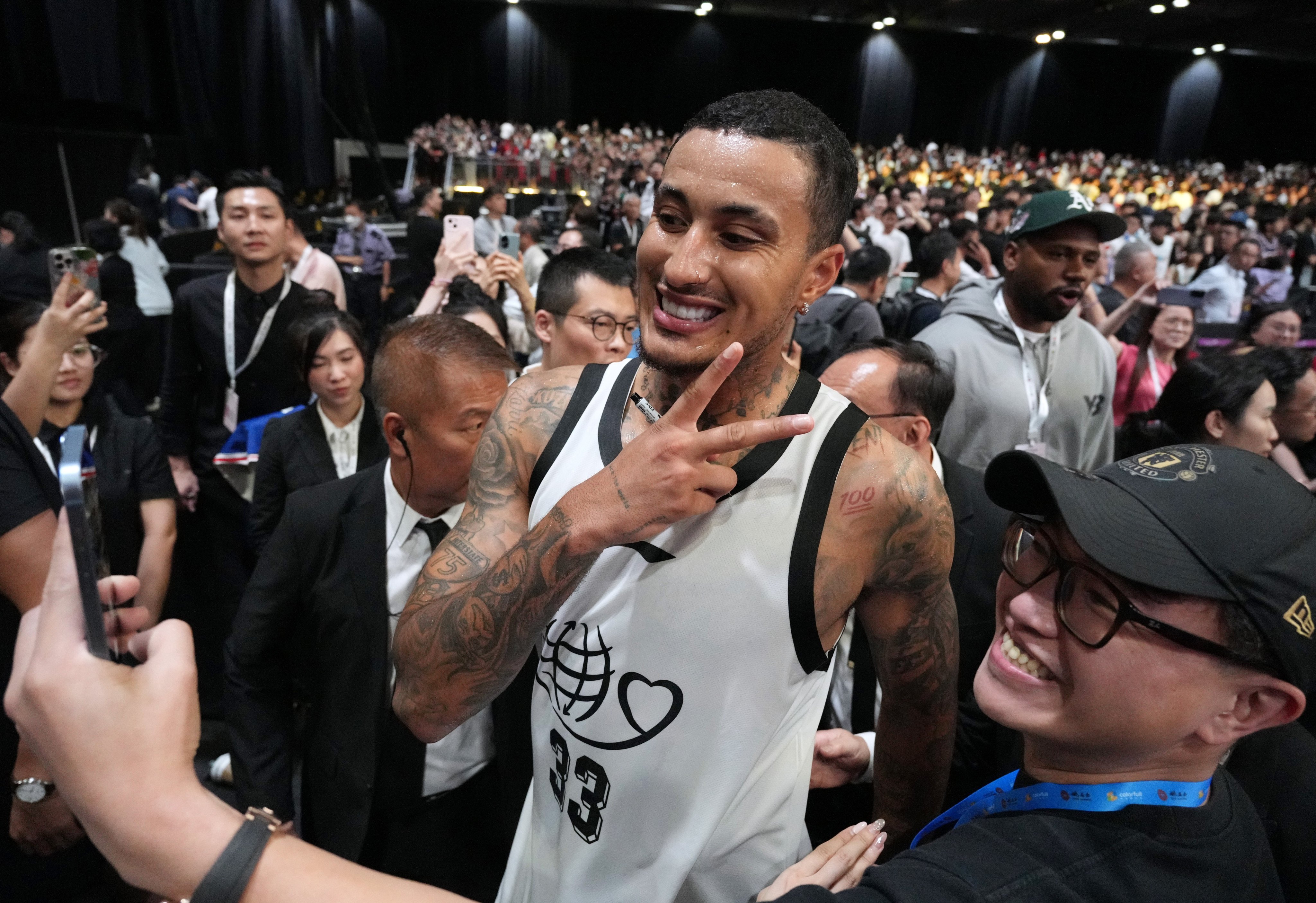 NBA star Kyle Kuzma takes a selfie with a fan at the 12th Yao Foundation Charity Game at Asia World-Expo. Photo: Eugene Lee