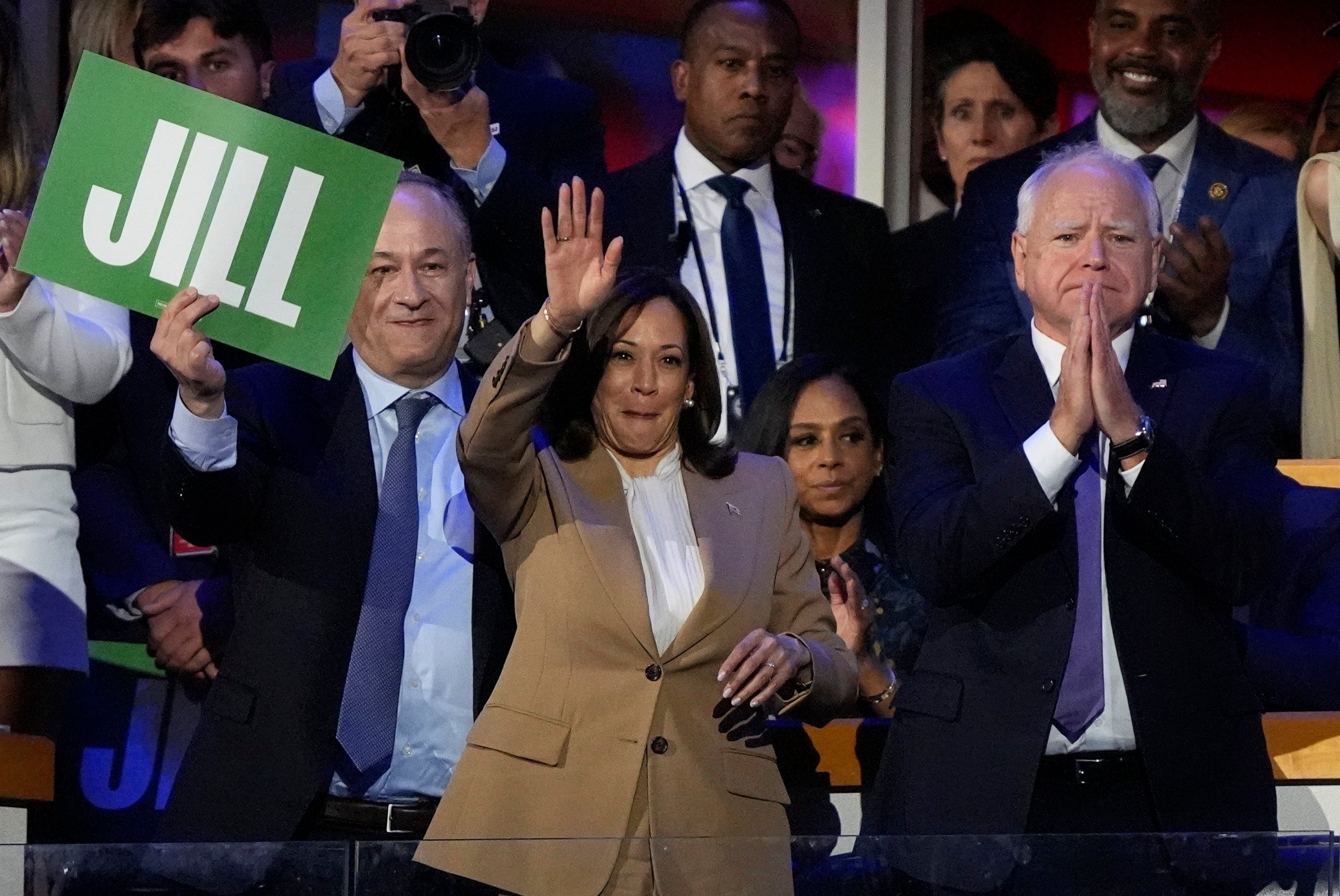 Democratic presidential nominee and current US Vice-President Kamala Harris, centre, and vice-presidential nominee Minnesota Governor Tim Walz, right, listen to First Lady Jill Biden speak during the Democratic National Convention in Chicago on August 19. Photo: AP