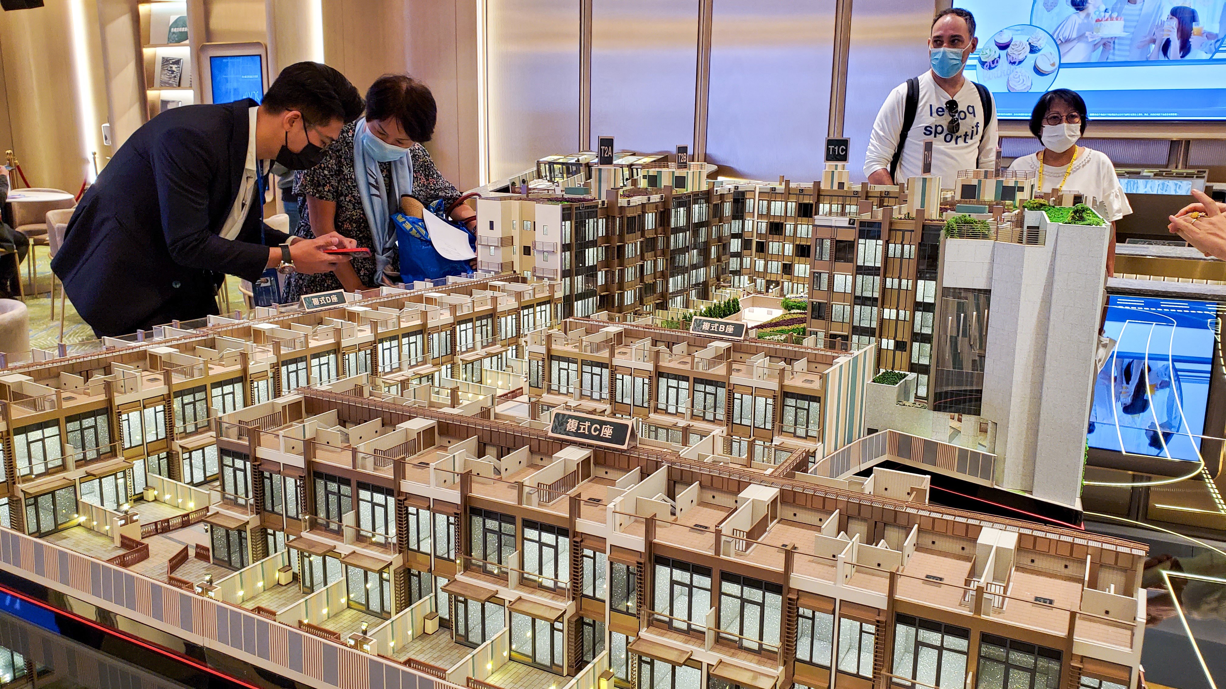 Potential buyers view a model of CK Asset’s #Lyos housing project during its launch in November 2021. A few buyers have forfeited their deposits for units in the project. Photo: Edmond So