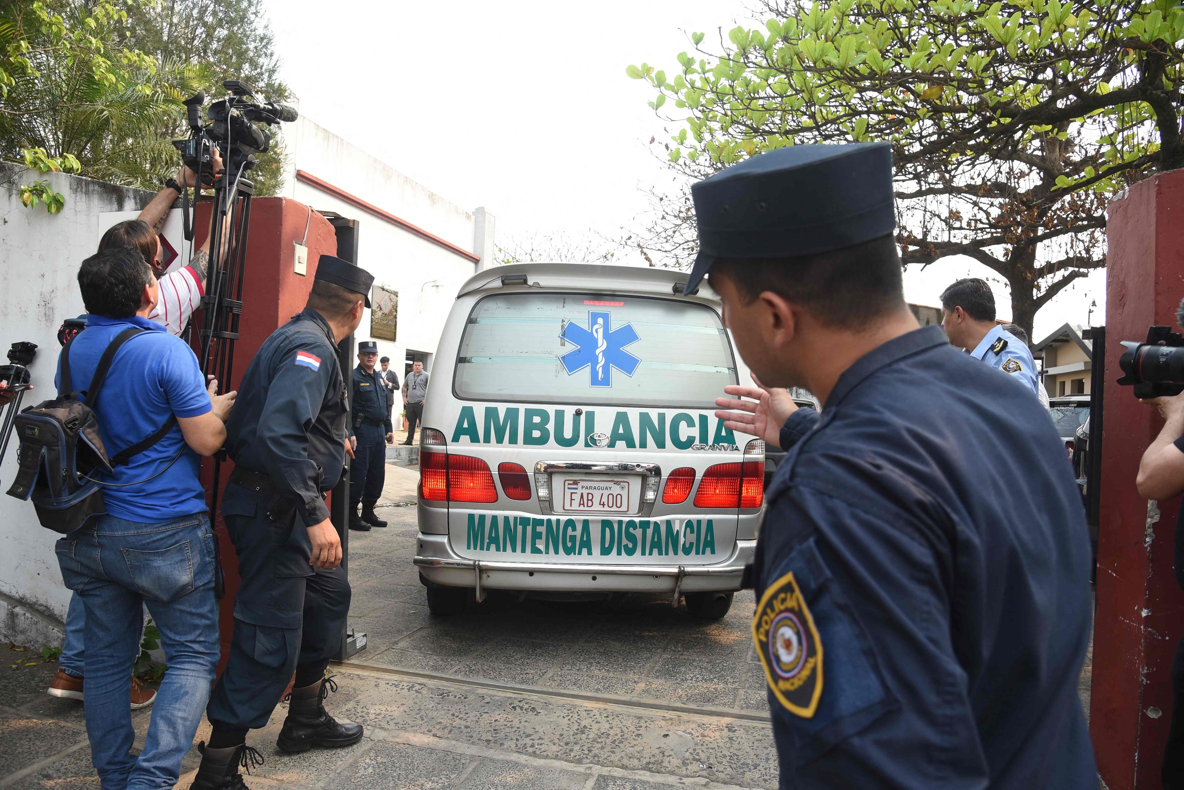 An ambulance carrying the body of Eulalio “Lalo” Gomez arrives at the local morgue in Asuncion on August 19. Photo: AFP