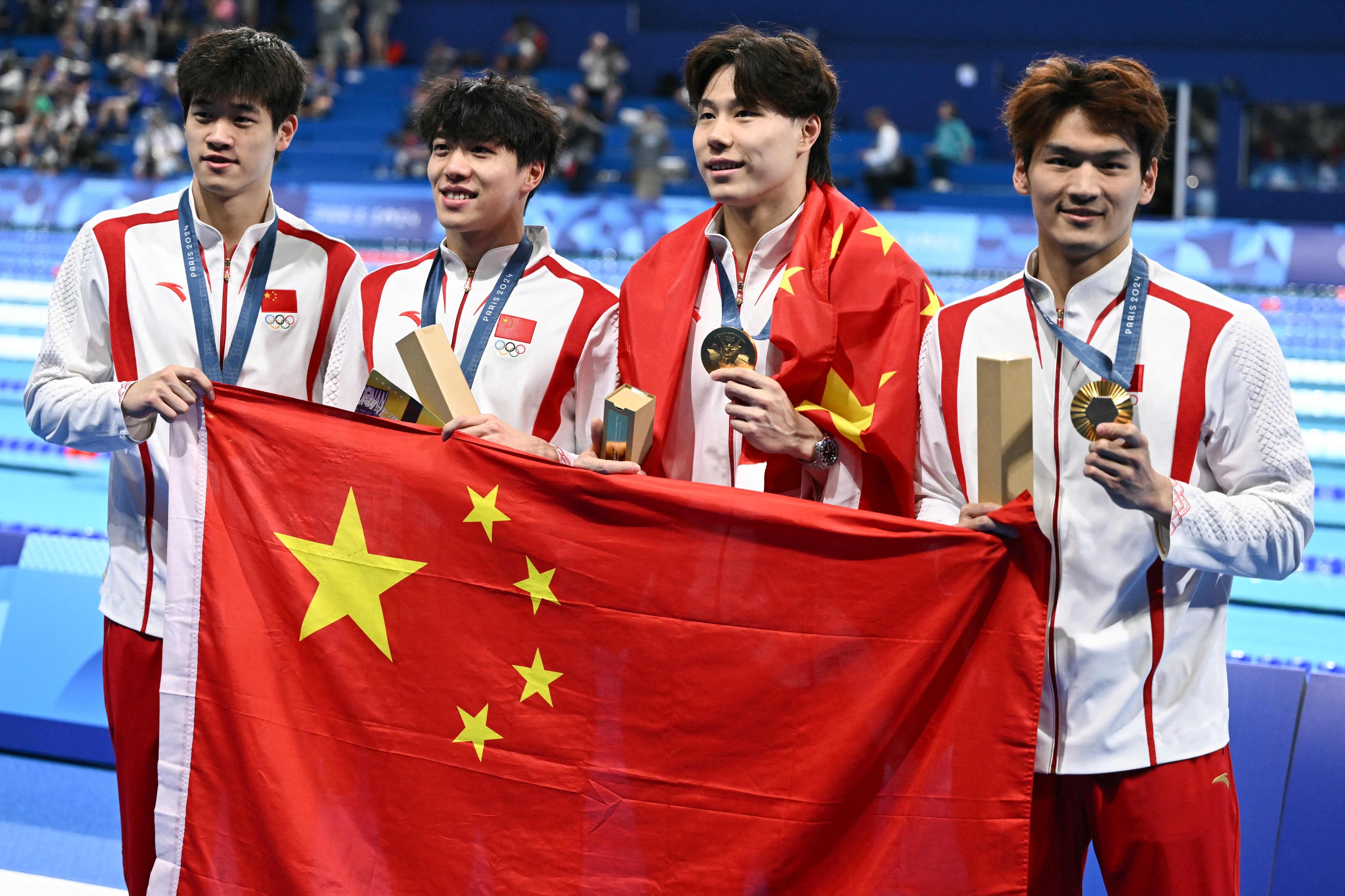 China’s Pan Zhanle, Sun Jiajun, Qin Haiyang and Xu Jiayu after winning men’s 4x100m medley relay gold at the Paris Olympics. Photo: AFP