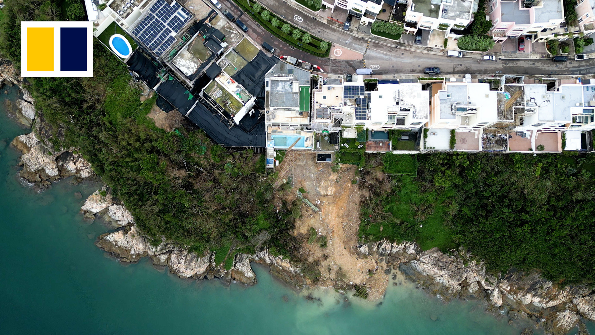 This screen capture from an SCMP video shows how a landslide revealed illegal basements under luxury Hong Kong homes at Redhill Peninsula in Tai Tam. Photo: SCMP