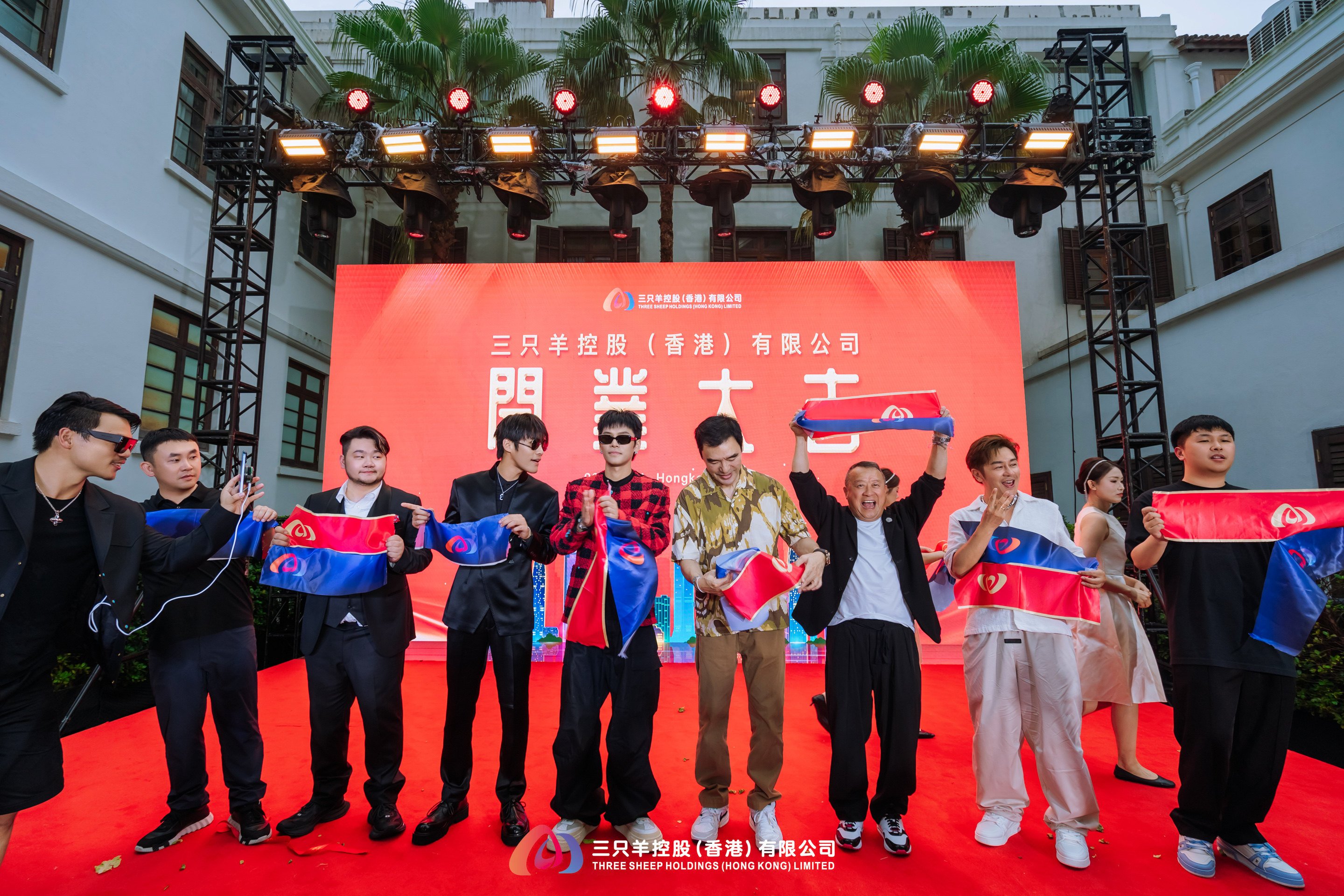 Three Sheep Group, the firm founded by Zhang Qingyang, known as Crazy Xiaoyangge (in red and black jacket), held a ceremony for the opening of its Hong Kong branch on Thursday. Photo: Three Sheep Group