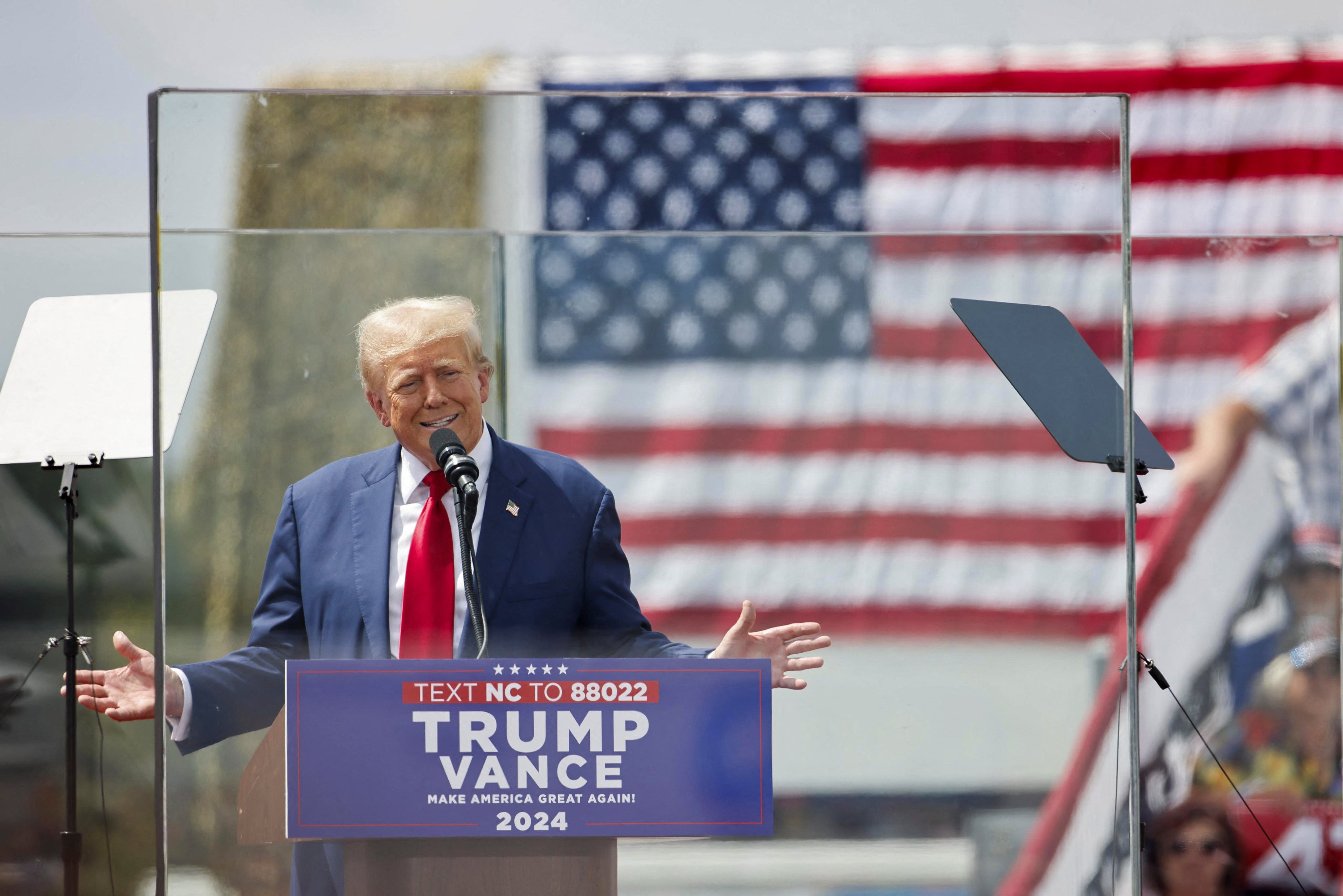 Republican US presidential nominee Donald Trump speaks from behind panes of bulletproof glass in Asheboro, North Carolina, on Wednesday. Photo: Reuters