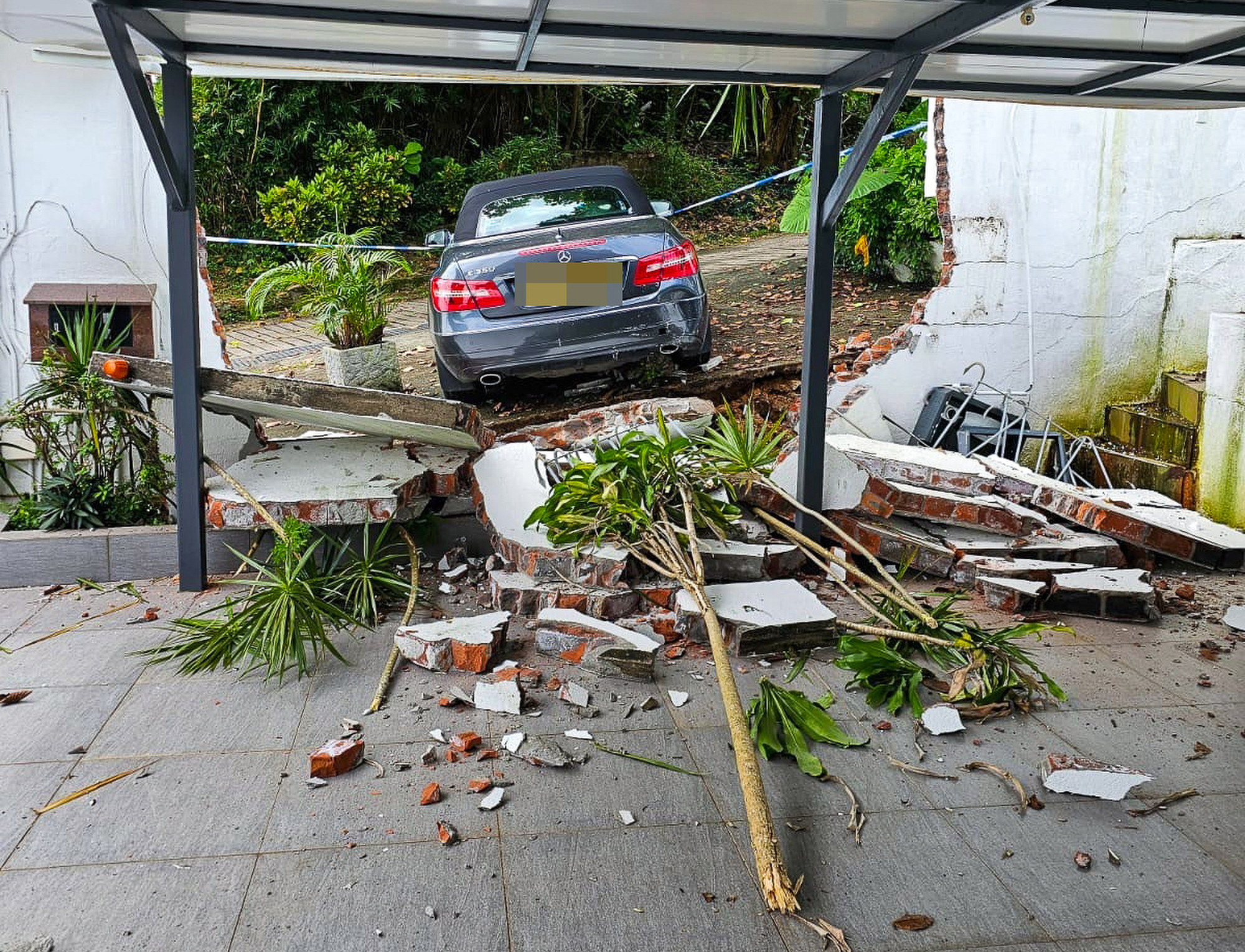 A Mercedes-Benz rolled back into a village house on Thursday. Photo: Handout