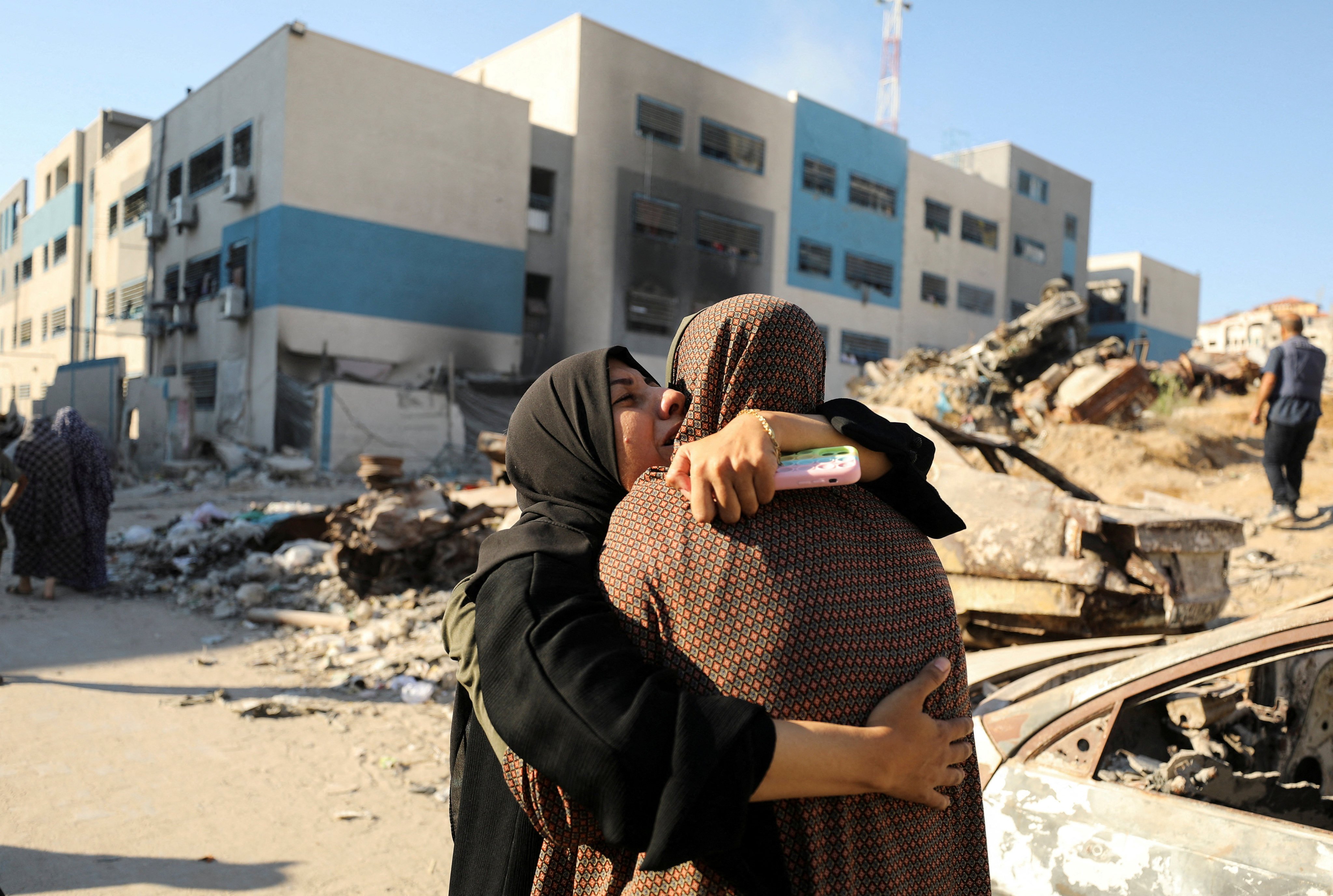 Palestinians react after a school sheltering displaced people was hit by an Israeli strike in Gaza City on Wednesday. Photo: Reuters