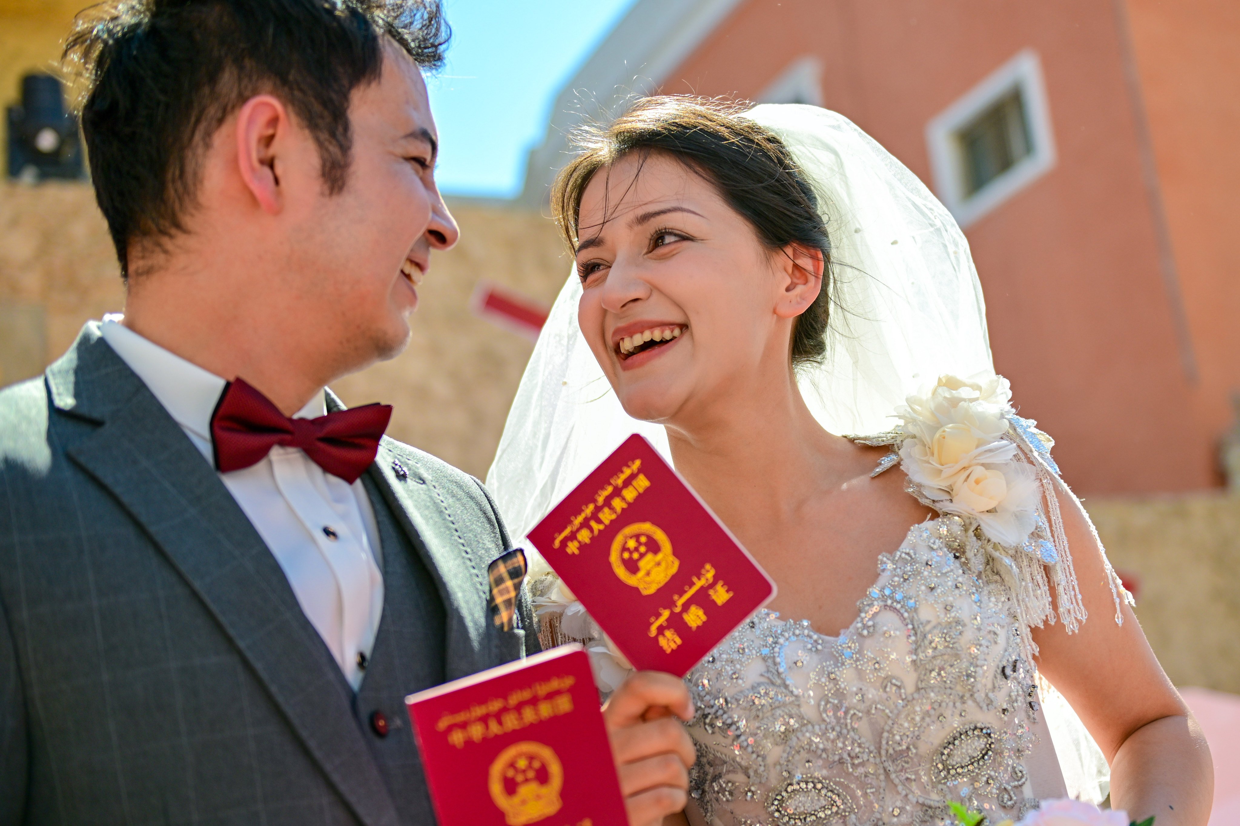 Newly-weds at a group ceremony in Urumqi, Xinjiang this month. The government is trying to encourage young people to get married. Photo: Xinhua