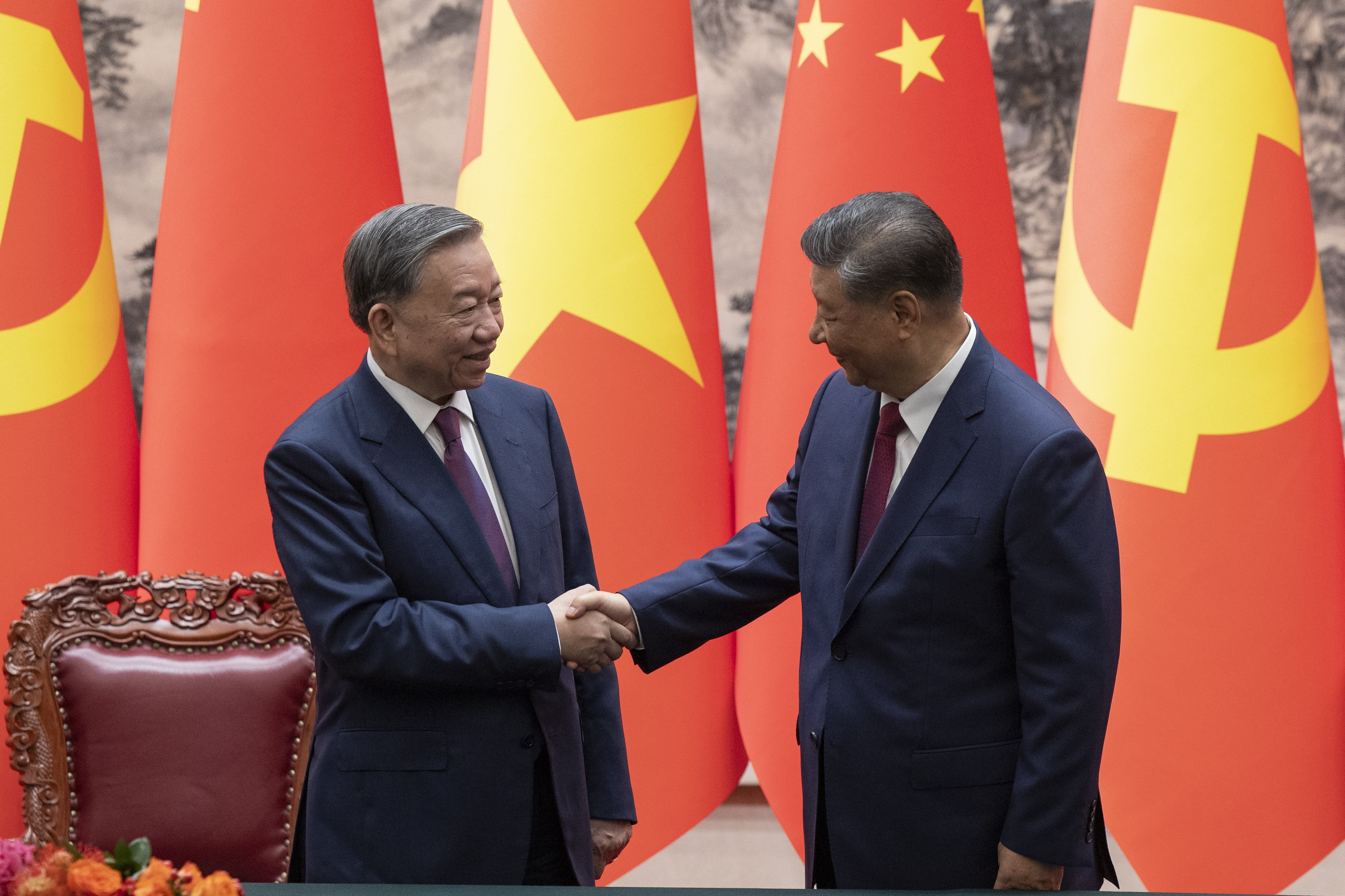 Chinese President Xi Jinping shakes hands with Vietnam’s To Lam after a signing ceremony in Beijing on Monday. Photo: EPA-EFE