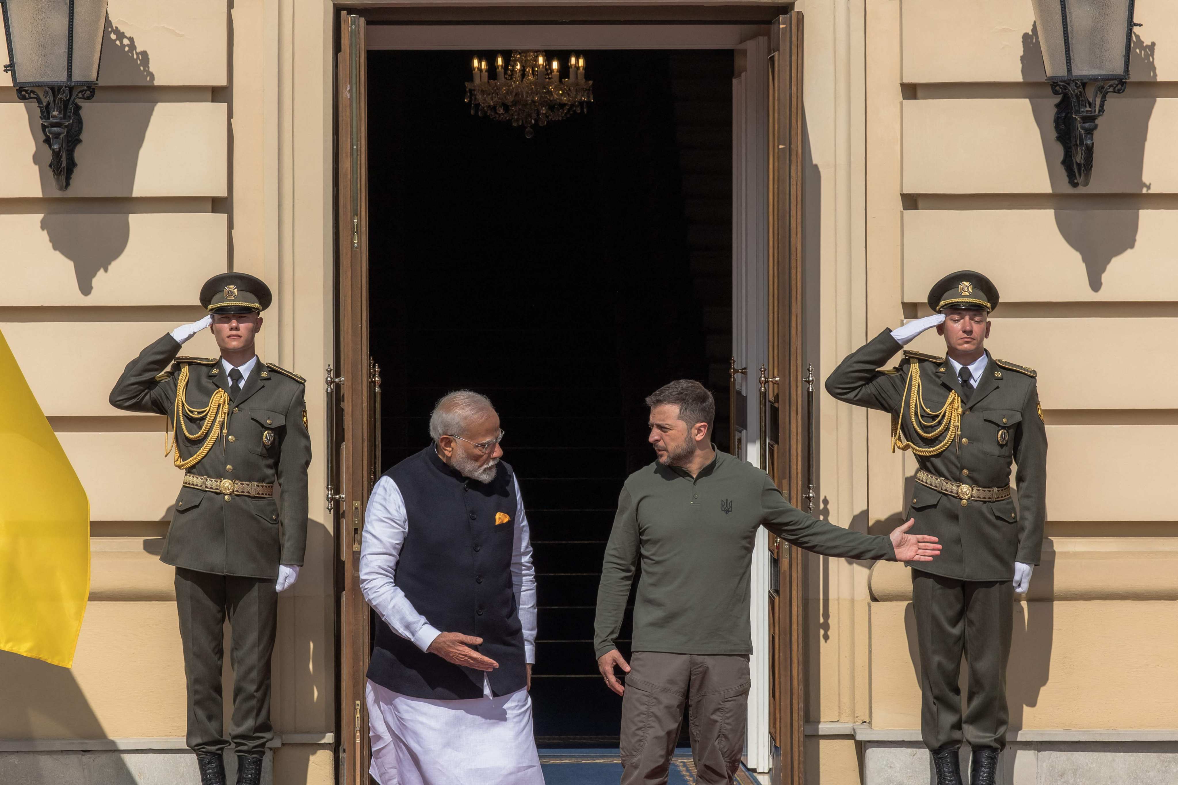 Ukrainian President Volodymyr Zelensky (right) shows the way to Indian Prime Minister Narendra Modi at the entrance of the Mariinskyi Palace. Photo: AFP