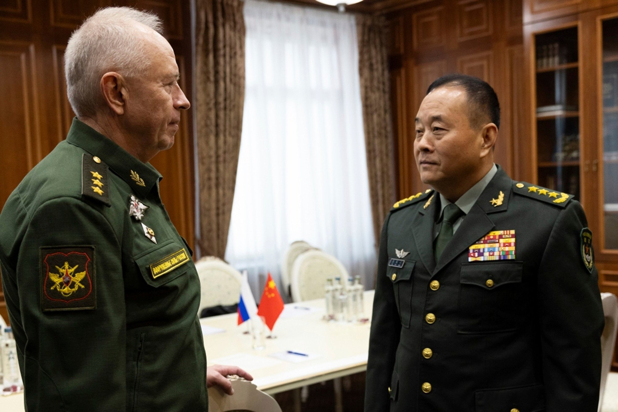 PLA Ground Forces Commander General Li Qiaoming with Russian Deputy Defence Minister Colonel General Alexander Fomin, in Moscow on Thursday. Photo: Handout via AP 