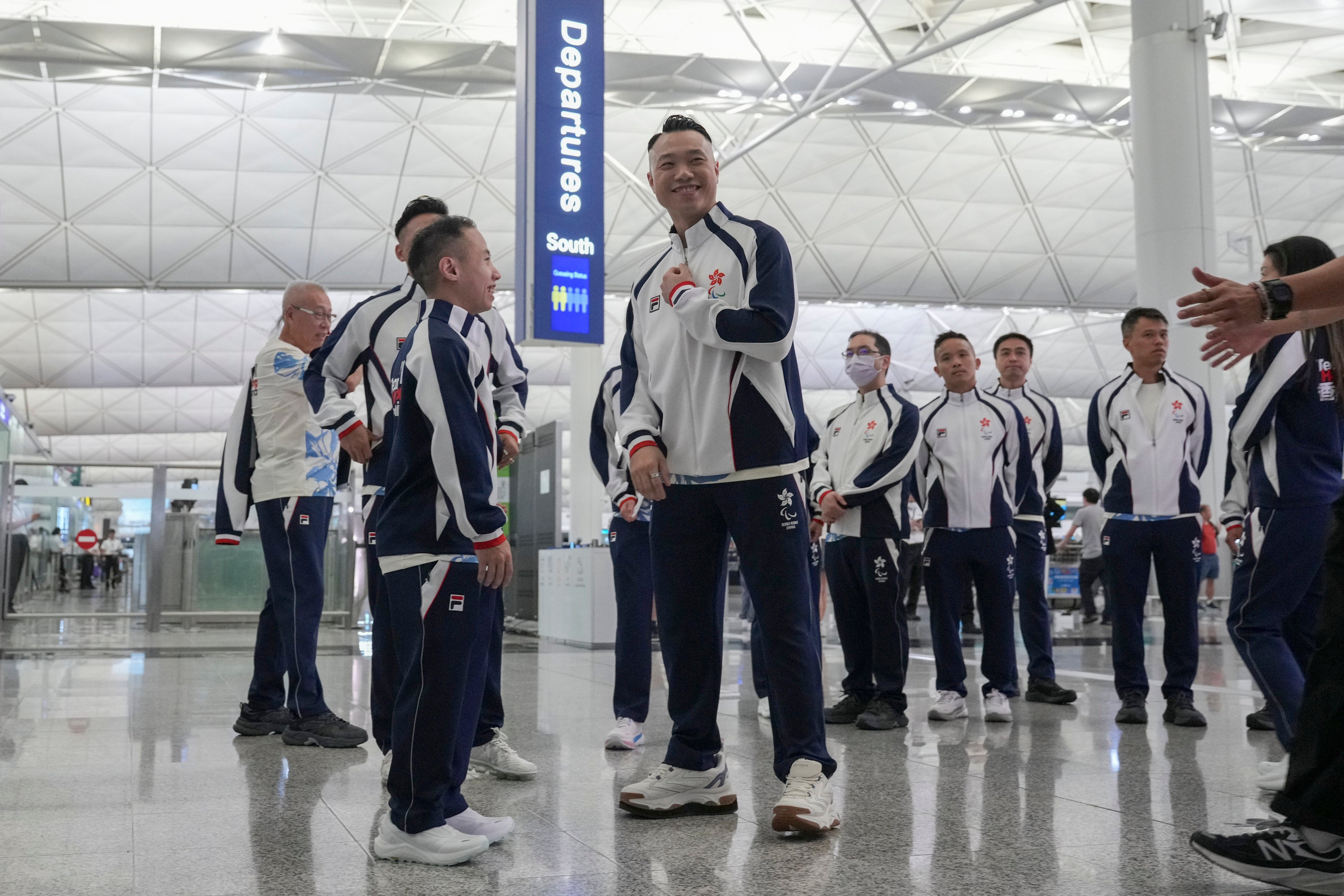 Badminton pair Chu Man-kai (left) and Daniel Chan get ready to leave for Paris from Hong Kong International Airport. Photo: Eugene Lee