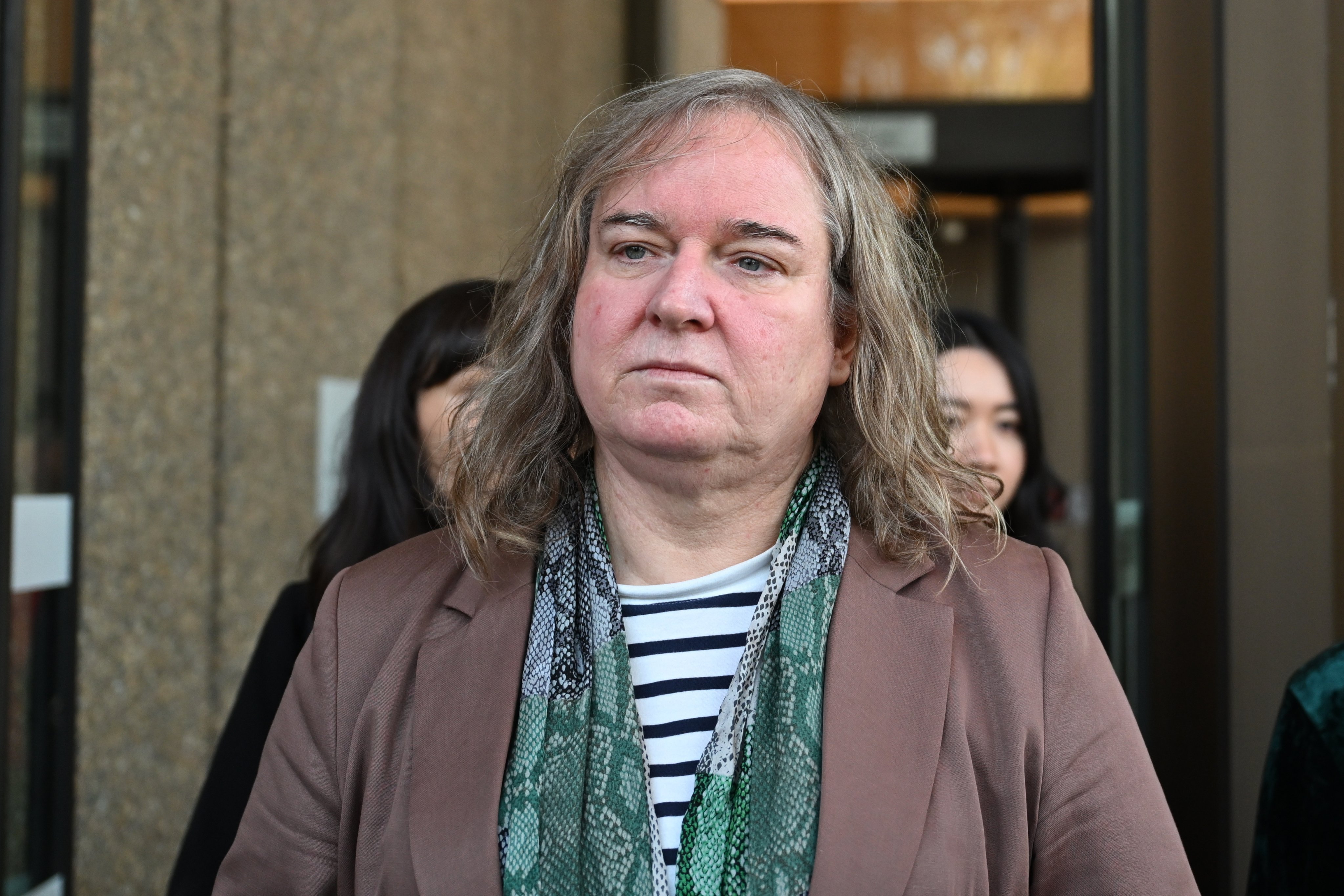 Roxanne Tickle leaves the Federal Court of Australia in Sydney on Friday. Photo: EPA-EFE