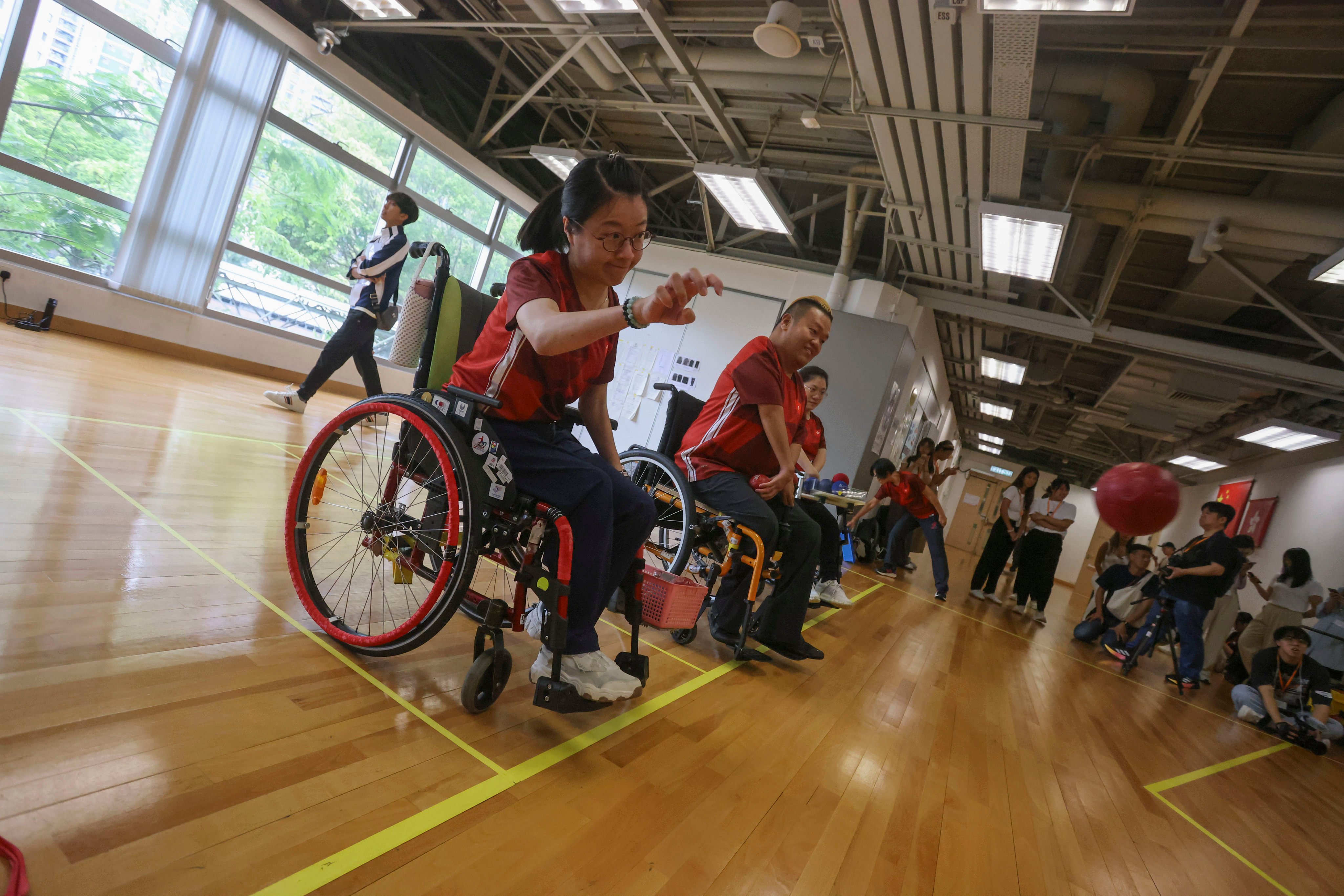 Boccia athletes Yeung Hiu-lam (left) and Leung Yuk-wing demonstrate their skills at Hong Kong Sports Institute ahead of leaving for the Paris Paralympics. Photo: Jonathan Wong