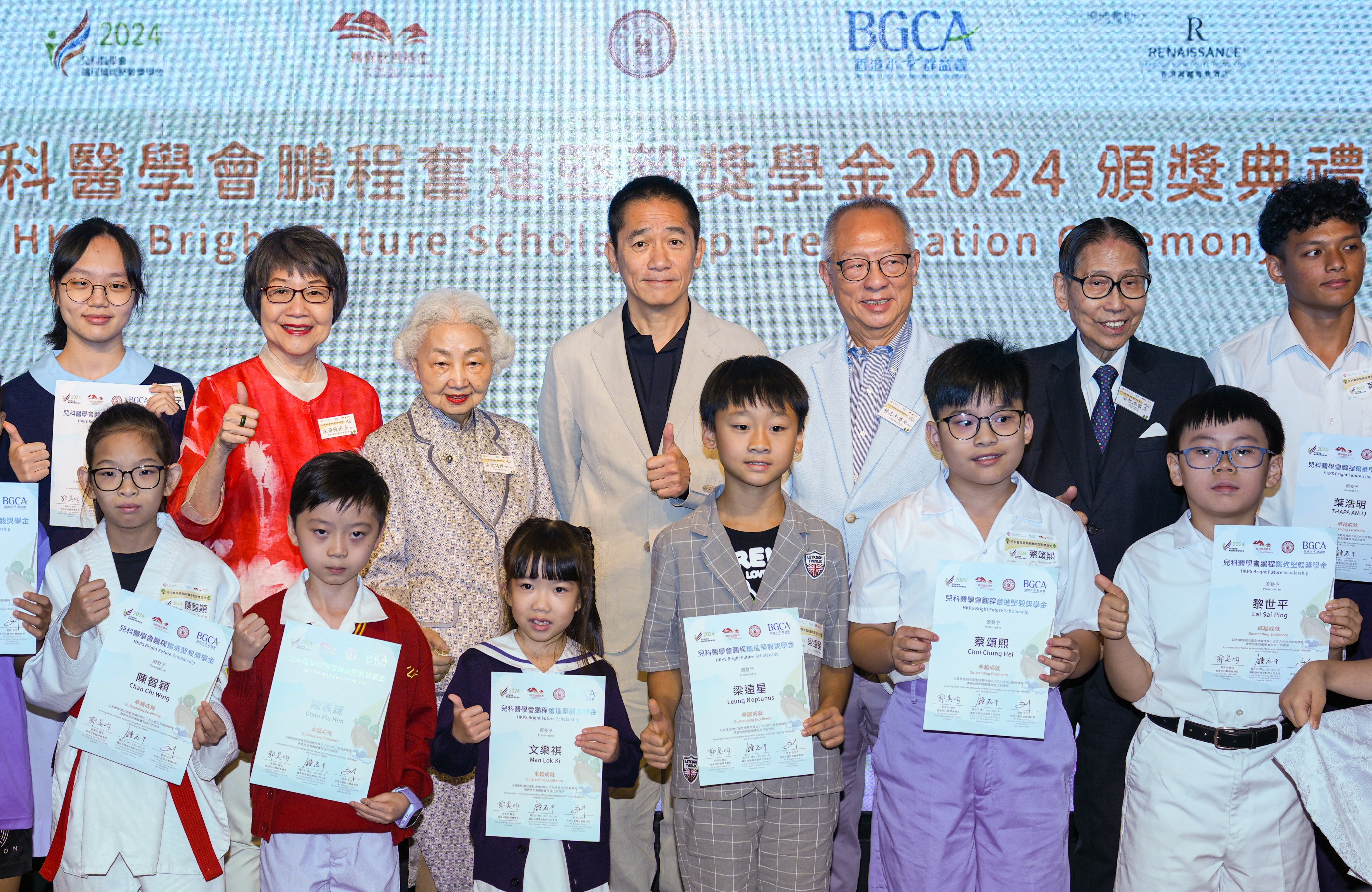 Actor Tony Leung and other scholarship patrons pose for photos with awardees of the Pediatric Society Bright Future Scholarship. Photo: Eugene Lee