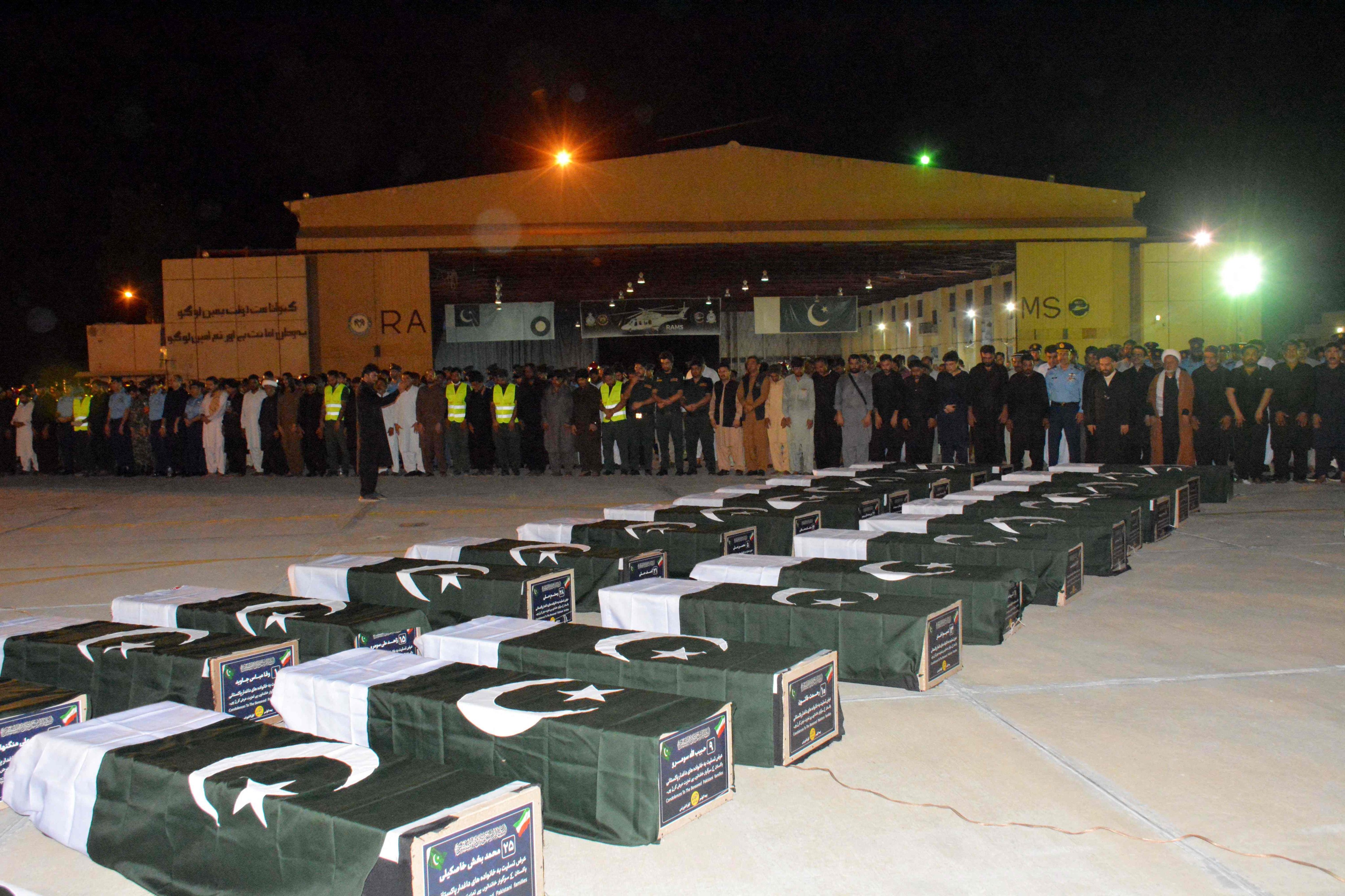 Government officials offer funeral prayers for those killed in a bus crash in Iran during a pilgrimage by Pakistani Shiite Muslims to Iraq for Arbaeen, on August 23 Friday. Photo: AFP