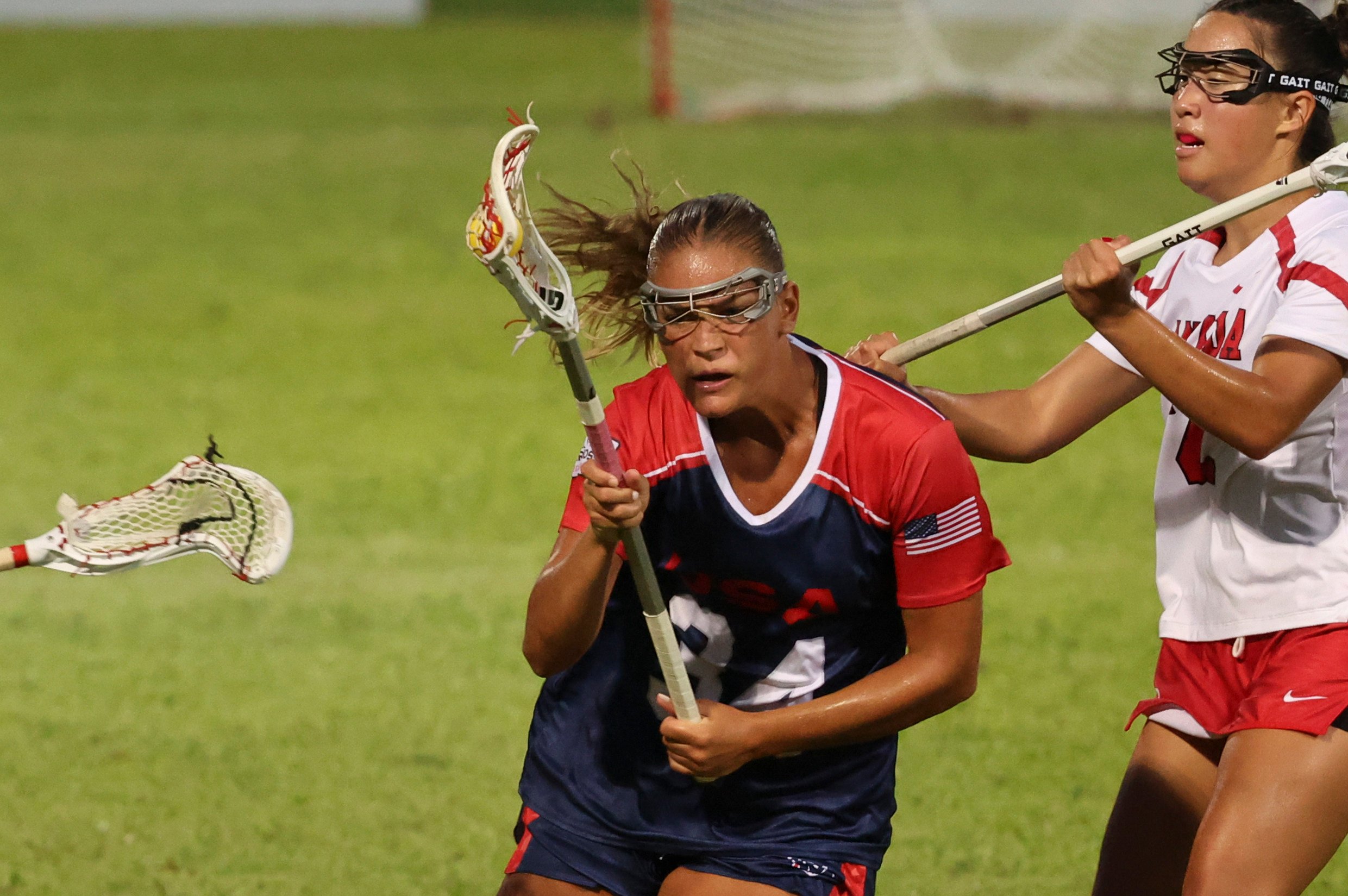 Kori Edmondson (centre) of the USA powers past several Canada players in the final of the World Lacrosse Women’s U20 Championship at Mong Kok Stadium. Photo: Dickson Lee