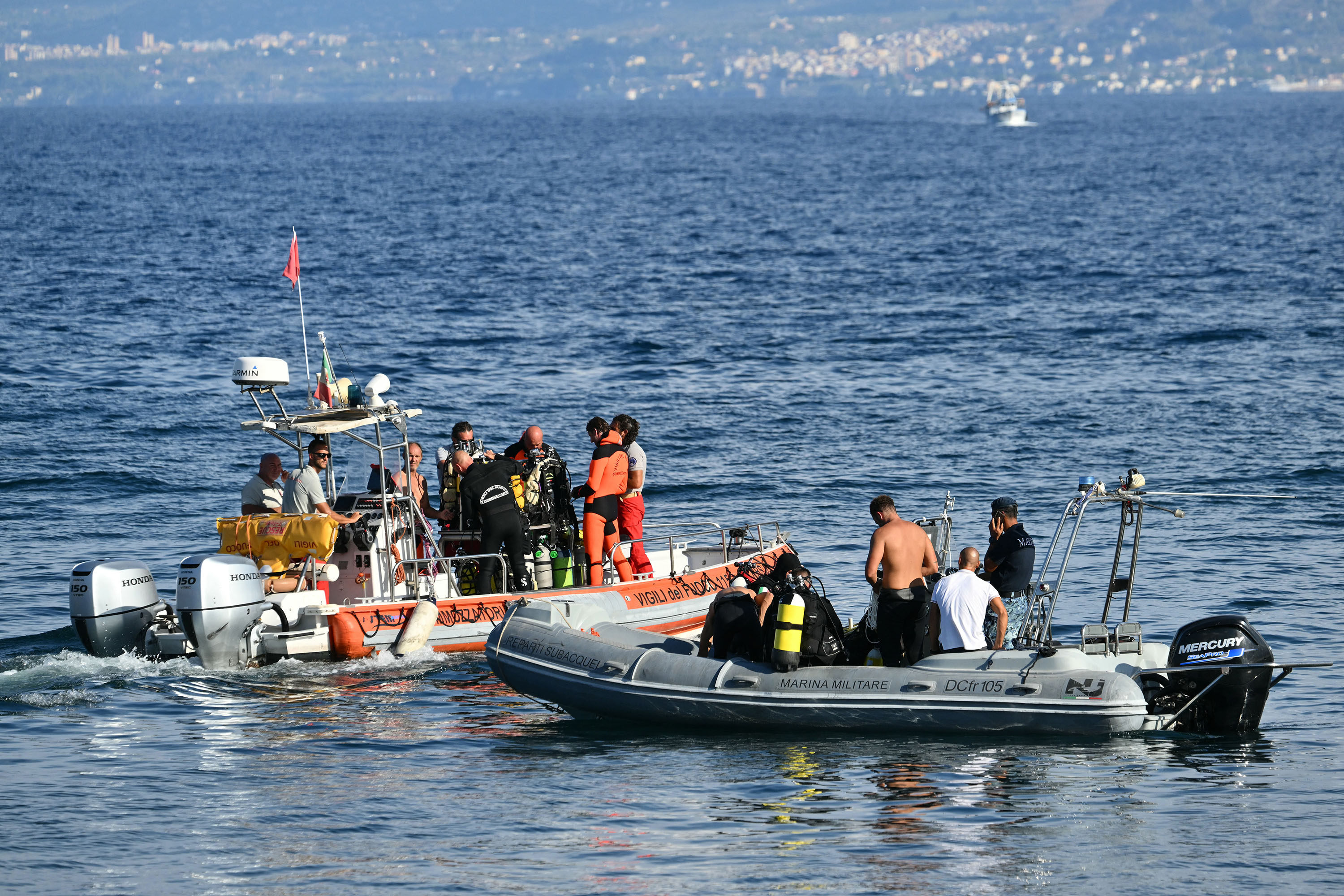 Rescue teams operate off Porticello harbour near Palermo on Thursday. Photo: TNS