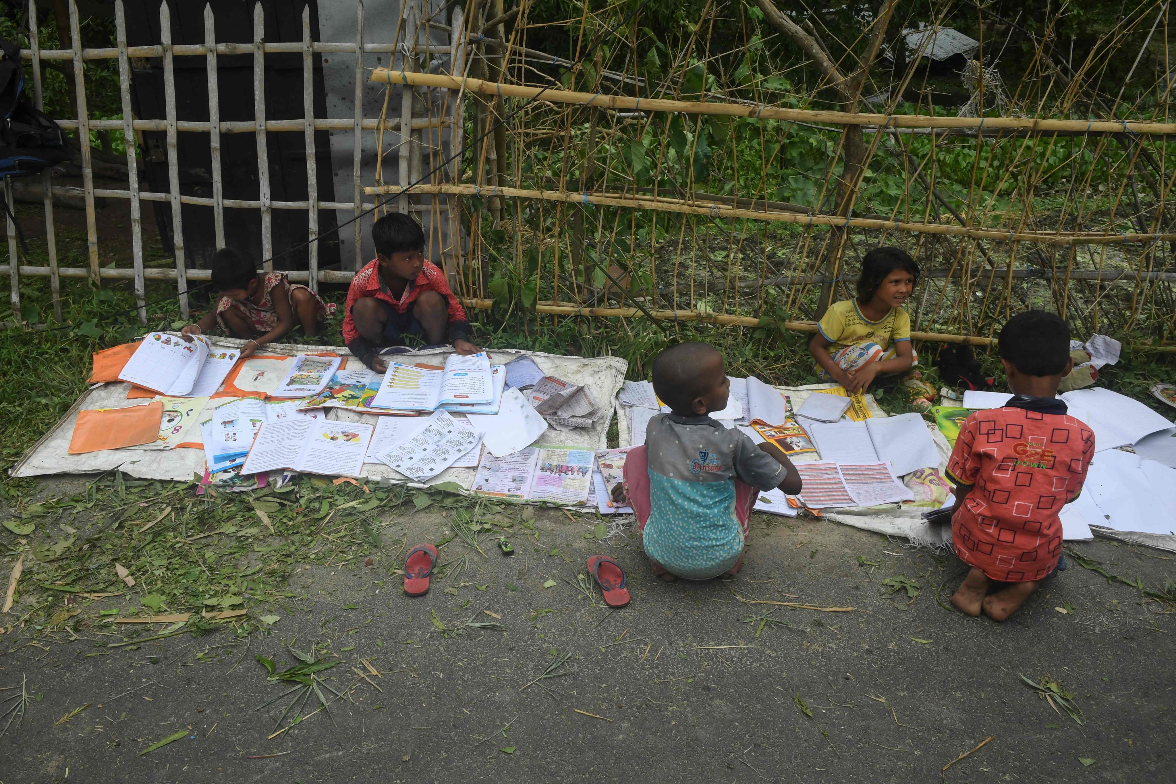 Children lay out their wet textbooks to dry after Cyclone Amphan made landfall on Khejuri in India’s eastern state of West Bengal in May 2020. The Bay of Bengal nations could unlock their educational and economic potential through effective Sino-Indian collaboration. Photo: AFP 