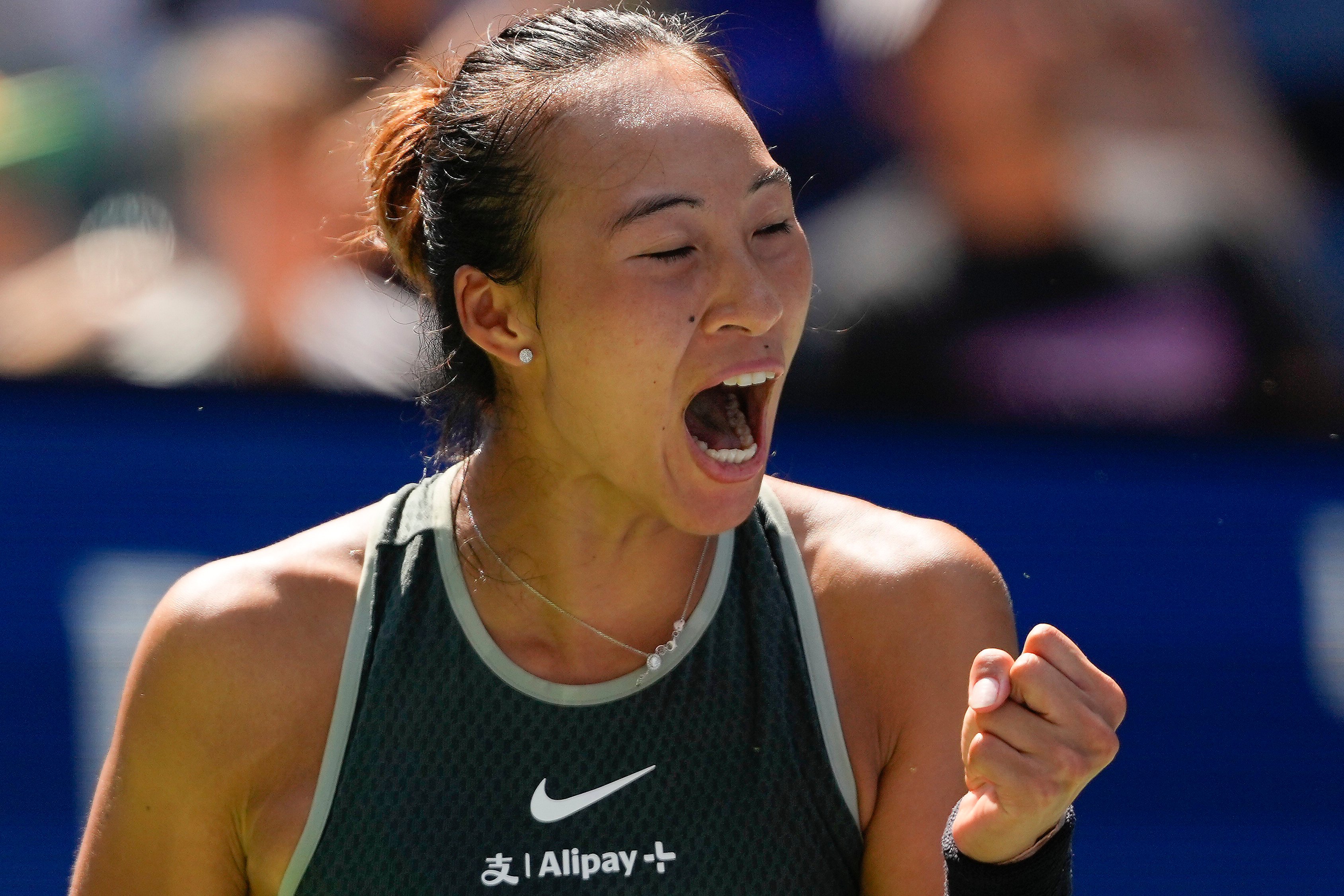 Zheng Qinwen celebrates winning a point during her women’s singles first round match against Amanda Anisimova at the US Open. Photo: AP