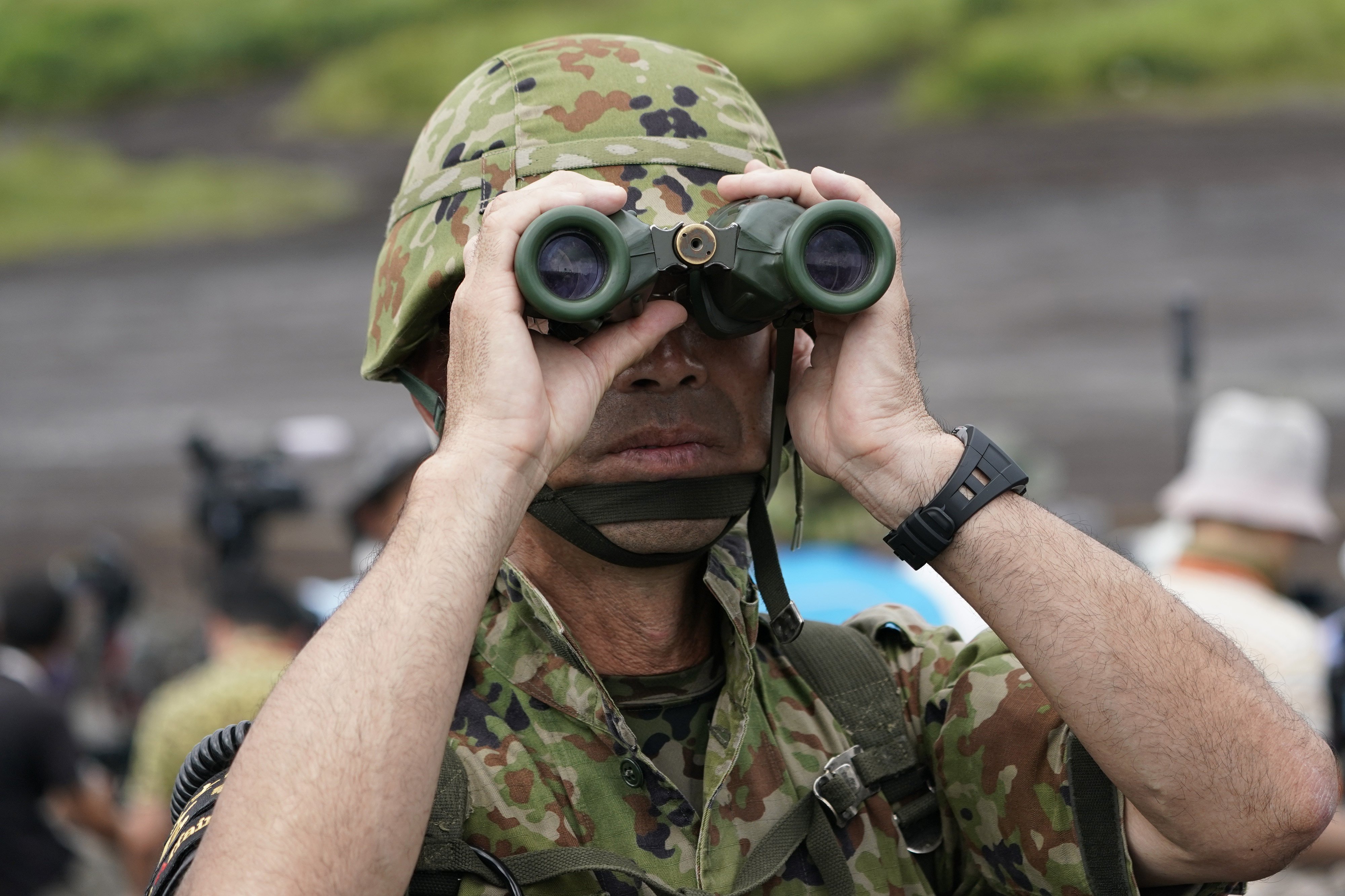 A Japanese soldier looks through binoculars during a live-fire exercise. Japan has ramped up defence spending in recent years, with US encouragement. Photo: Bloomberg