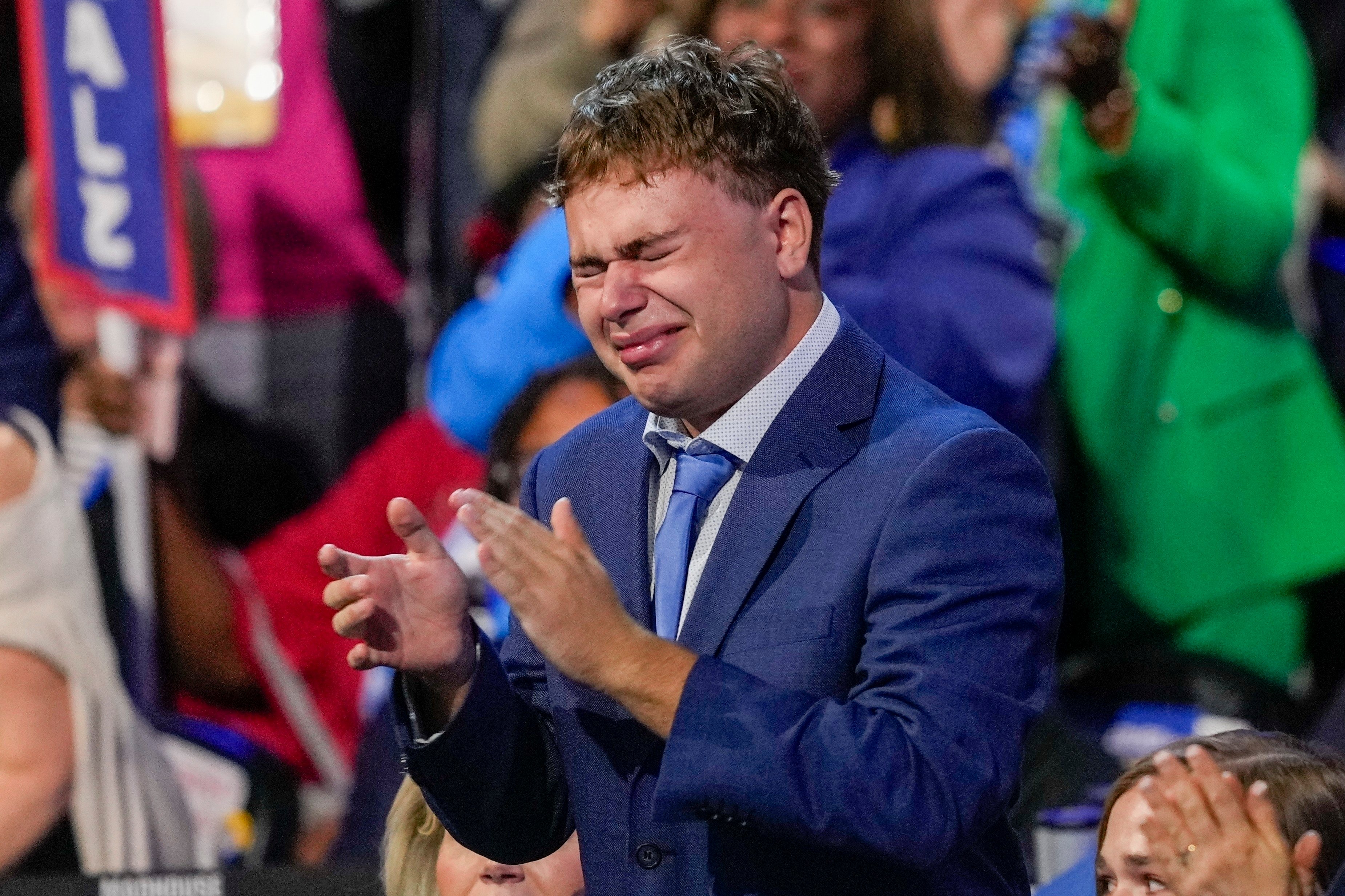 Gus Walz gets emotional as he applauds his father, Democratic vice-presidential nominee and Minnesota governor Tim Walz, during the Democratic National Convention in Chicago on August 21. Photo: AP 