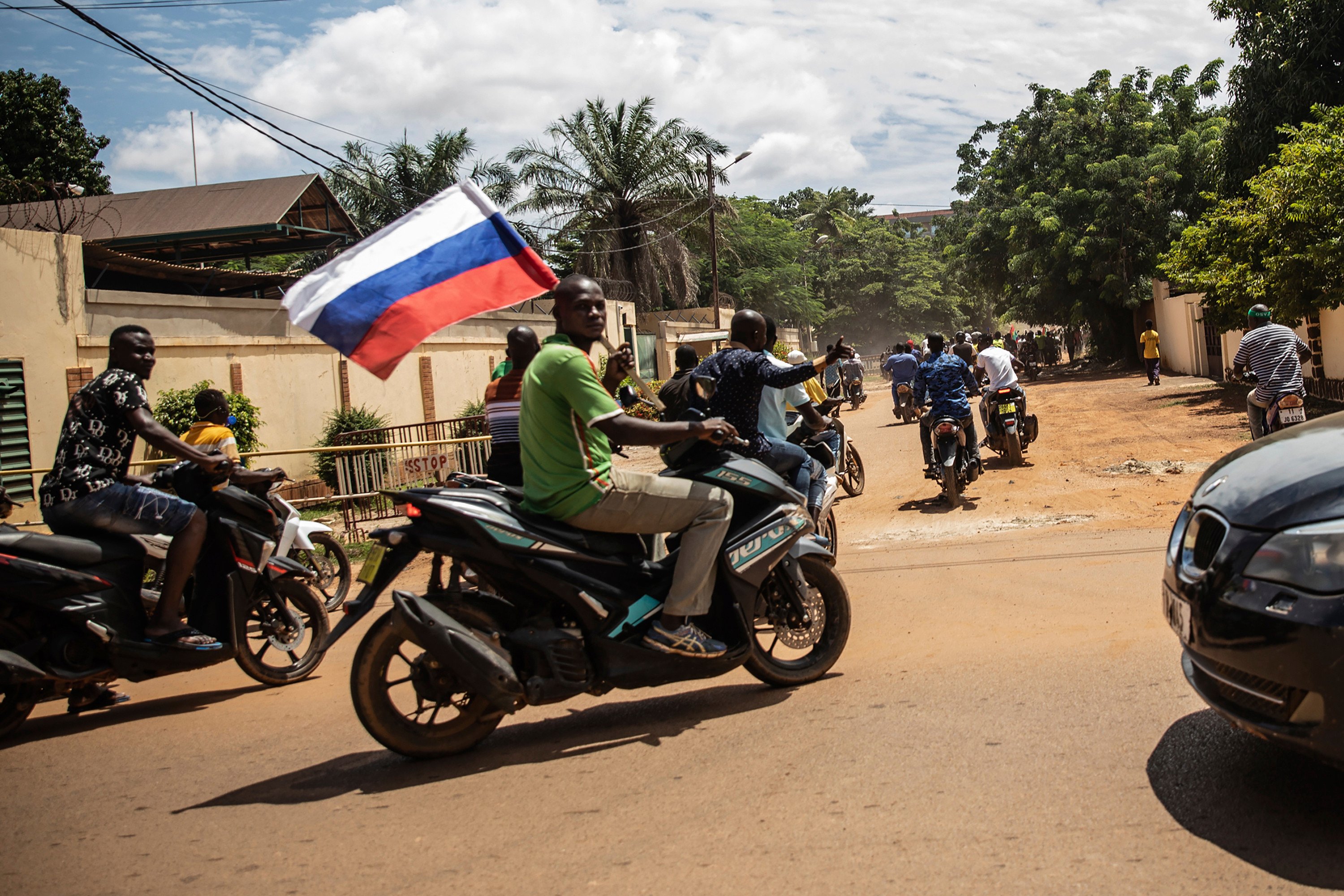 Junta supporters wave a Russian flag in the streets of Ouagadougou, Burkina Faso in 2022. File photo: AP 